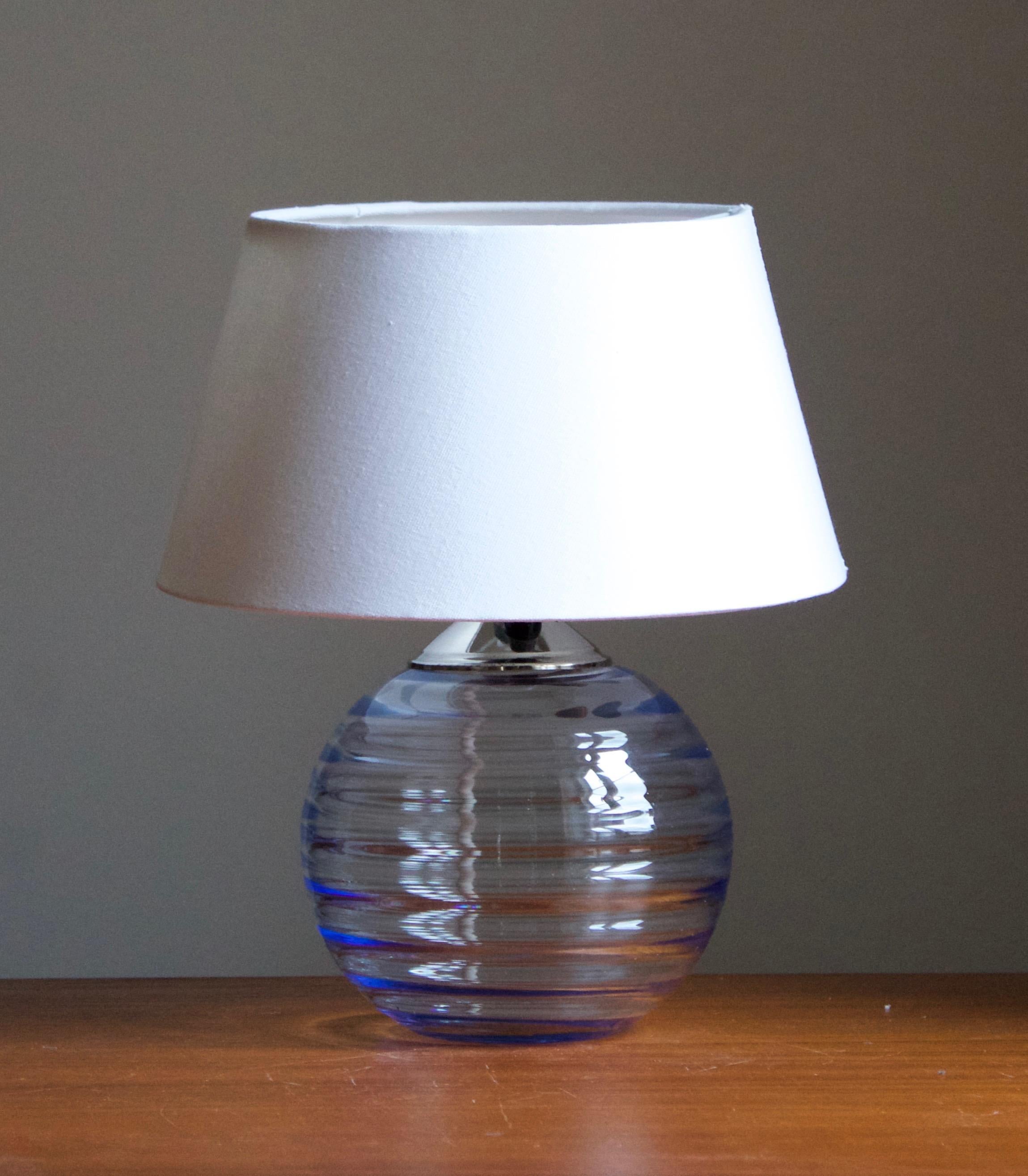 A modernist table lamp, design attributed to Edward Hald. Production attributed to Orrefors, c. 1930s.

Stated dimensions exclude lampshade. Height includes socket. Sold without lampshade.