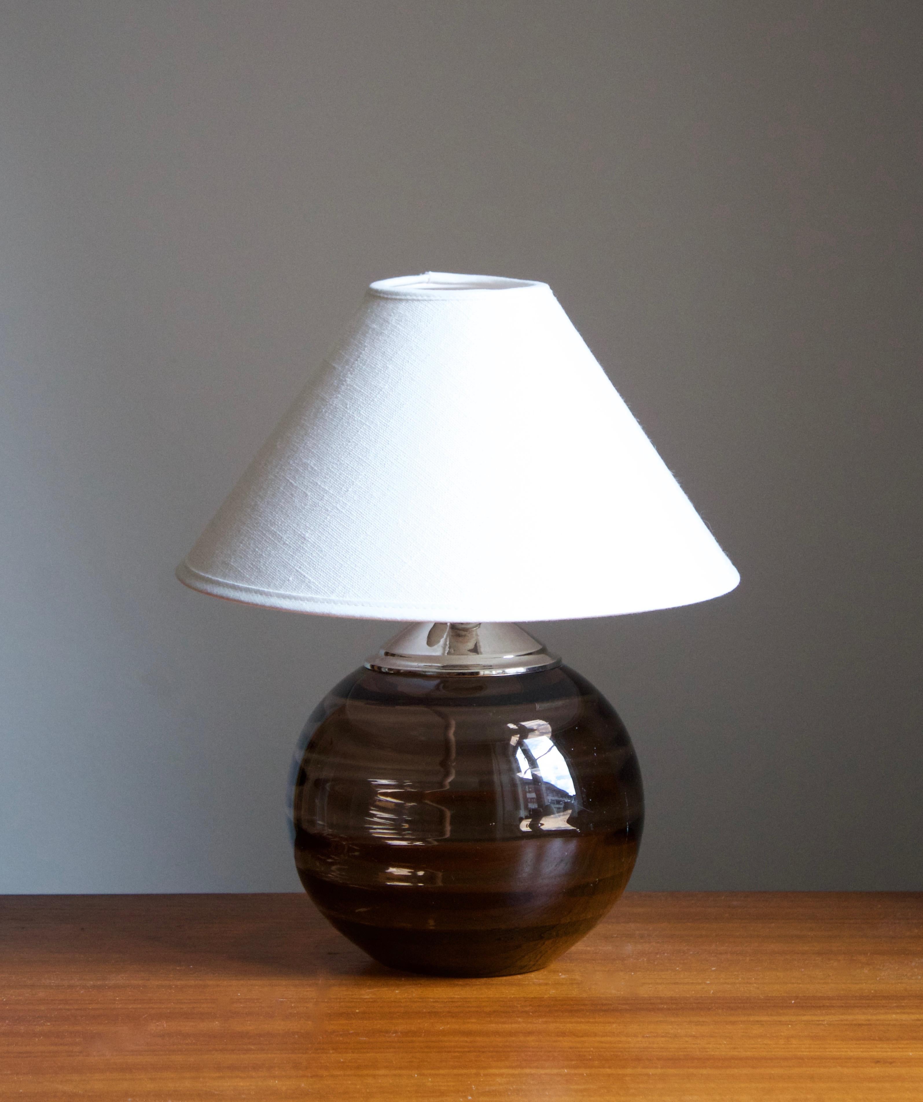 A modernist table lamp, design attributed to Edward Hald. Production attributed to Orrefors, c. 1930s.

Stated dimensions exclude lampshade. Height includes socket. Upon request and pending availability, illustrated lampshade can be included in