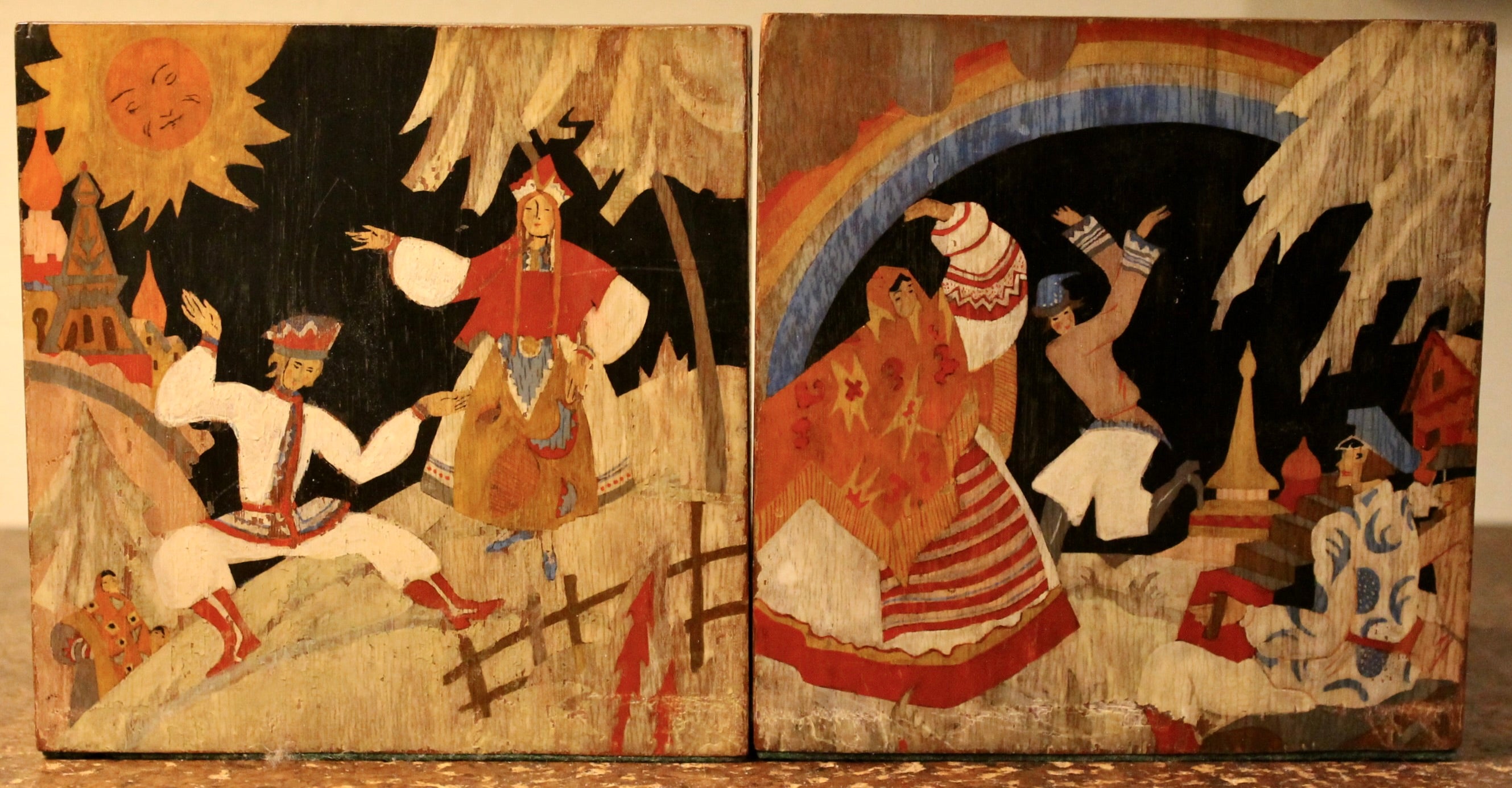 A pair of wood and copper bookends with original poi choir paintings of Russian Folk Dancing scenes by the French Illustrator/Painter Edouard Halouze.
Each: 5 1/2