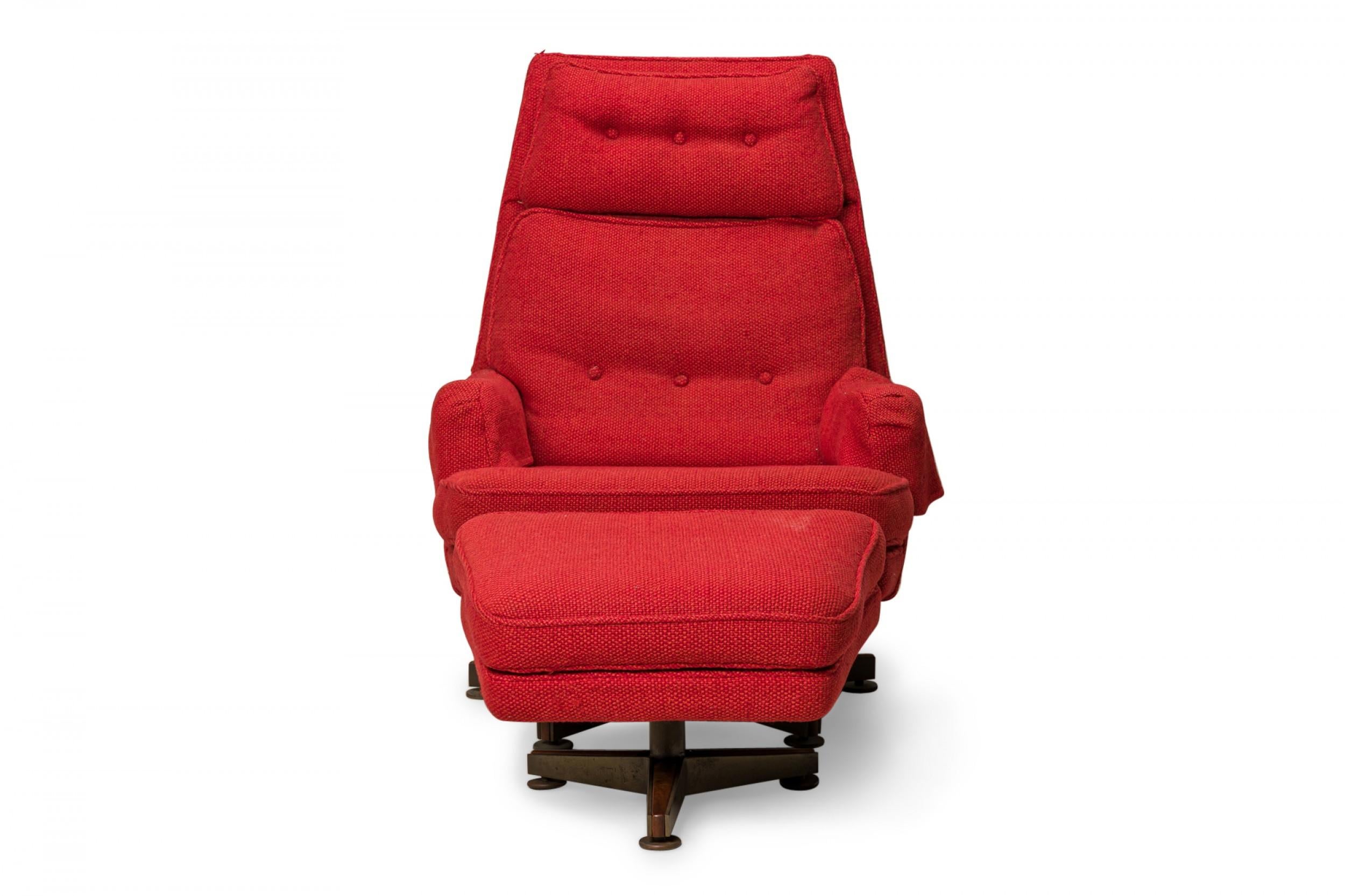 American Mid-Century tapered high back lounge armchair and matching wedge-form footstool, upholstered in a bright red textured fabric with button tufting on the headrest and back cushion and matching antimacassars, each resting on wood and brass