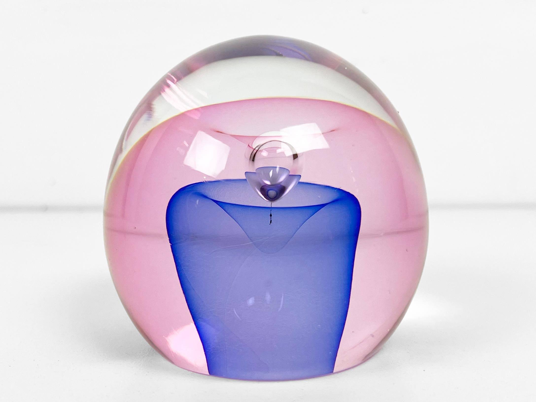 Orb shaped paperweight by glass artist Edward Kachurik in pink and blue. Signed 