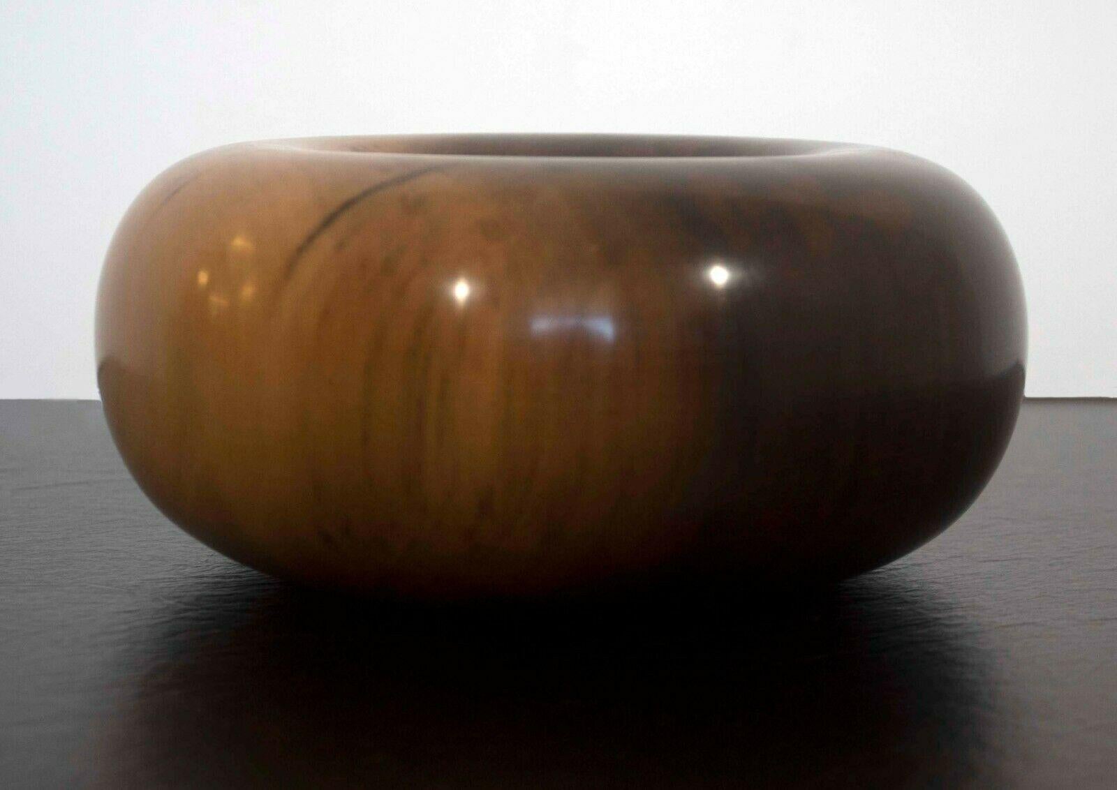 For your consideration is an outstanding turned donut wood sculpture signed on bottom Ed Moulthrop and with the following description: FIGURED TULIPWOOD LIRIODENDREN TULIPIFERA 216820. 

Trained as an architect, Moulthrop is a self-taught