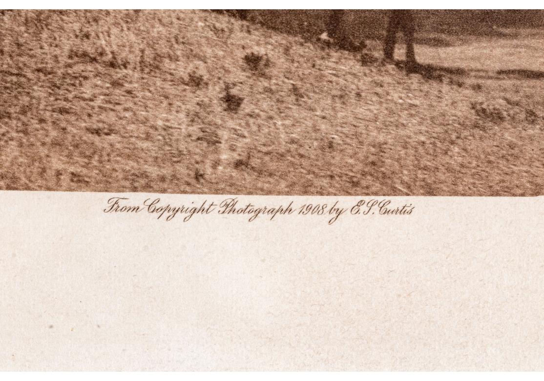 Edward S. Curtis (1868-1952) Rare photogravure Sepia intitulée Atsina War-Party en vente 1
