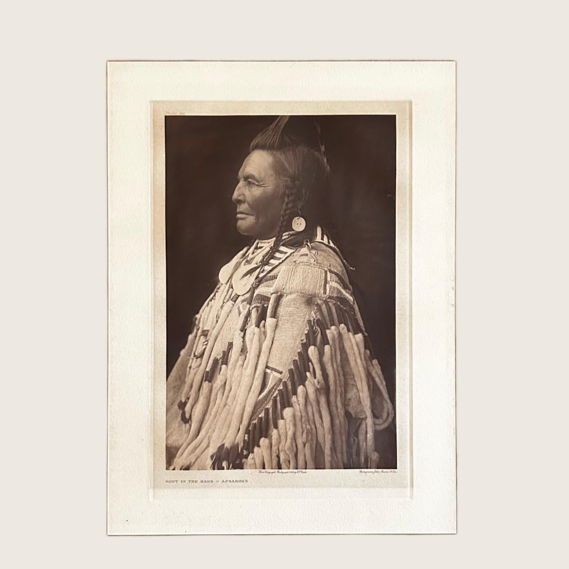 Edward S Curtis (1868-1952)
Title: Shot in The Hand - Apsaroke
Plate: 133
Portfolio: Volume IV
Printer: John Andrew & Son 
Medium: Photogravure
Date: 1908
Dimensions: 
Sheet: W 15 5/16 x H 20 11/16
Image: W 10 3/16 x H 15 11/16

The iconic subject