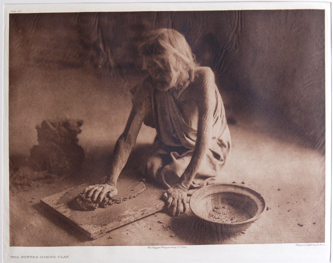 The Potter Mixing Clay, 1921 - Photograph by Edward S. Curtis