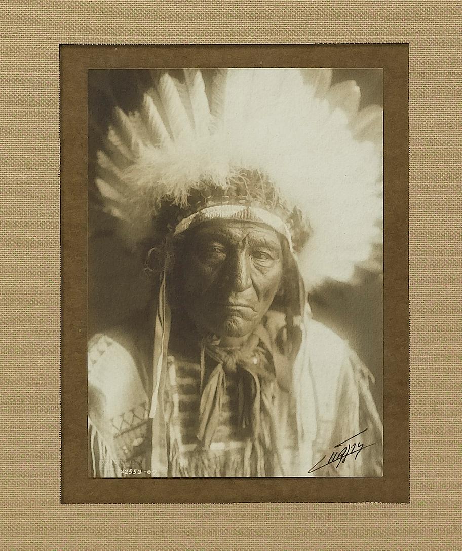This is an unpublished Edward Curtis signed photograph of an Apsaroke Indian Chief in a gold-leaf frame. It is an attractive piece from America's most prolific western photographer.

Edward S. Curtis created one of the most enduring and iconic