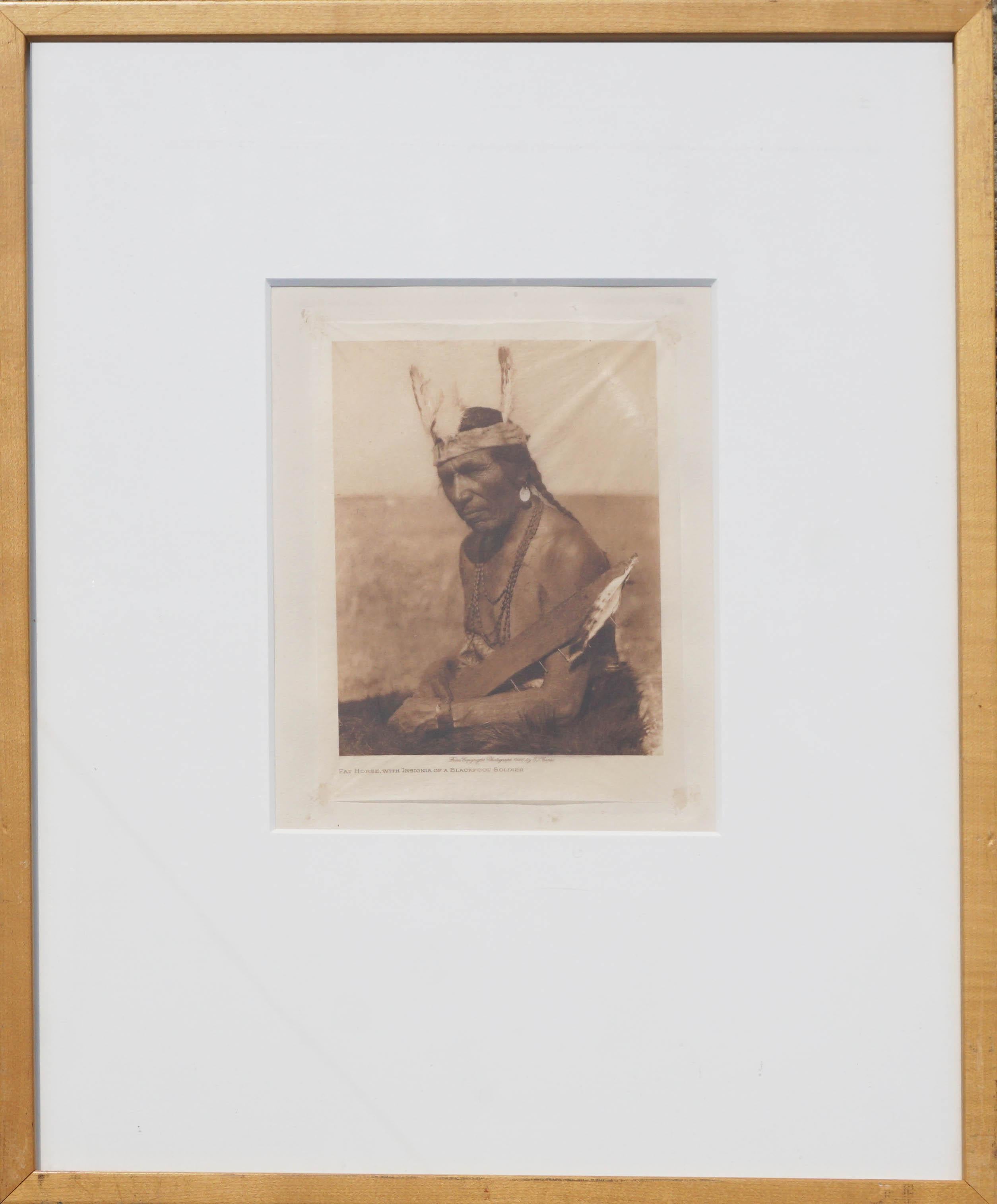 Early 20th Century Photogravure of Blackfoot Soldier -- Fat Horse  - Photograph by Edward Sheriff Curtis