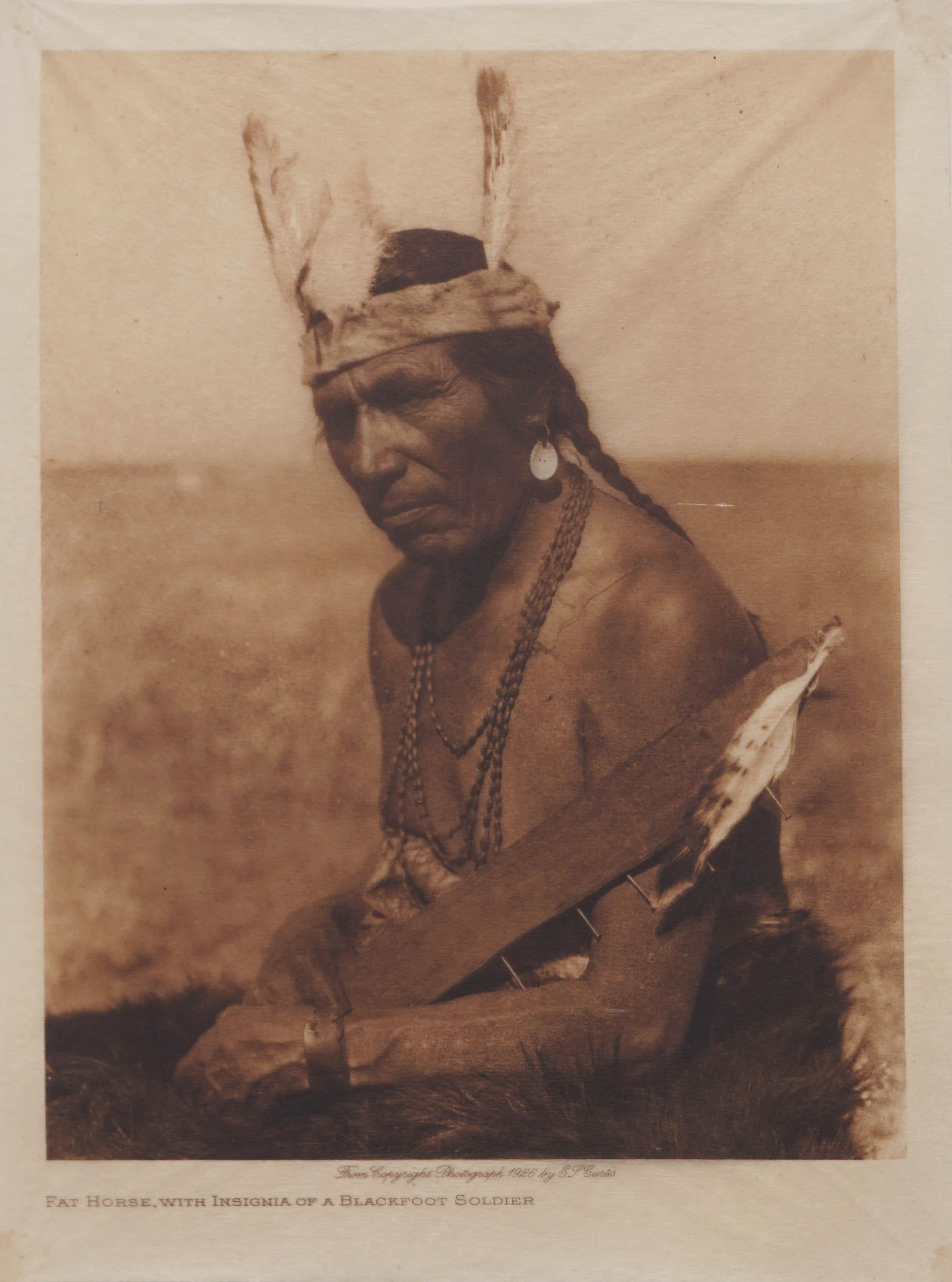 Edward Sheriff Curtis Portrait Photograph - Early 20th Century Photogravure of Blackfoot Soldier -- Fat Horse 