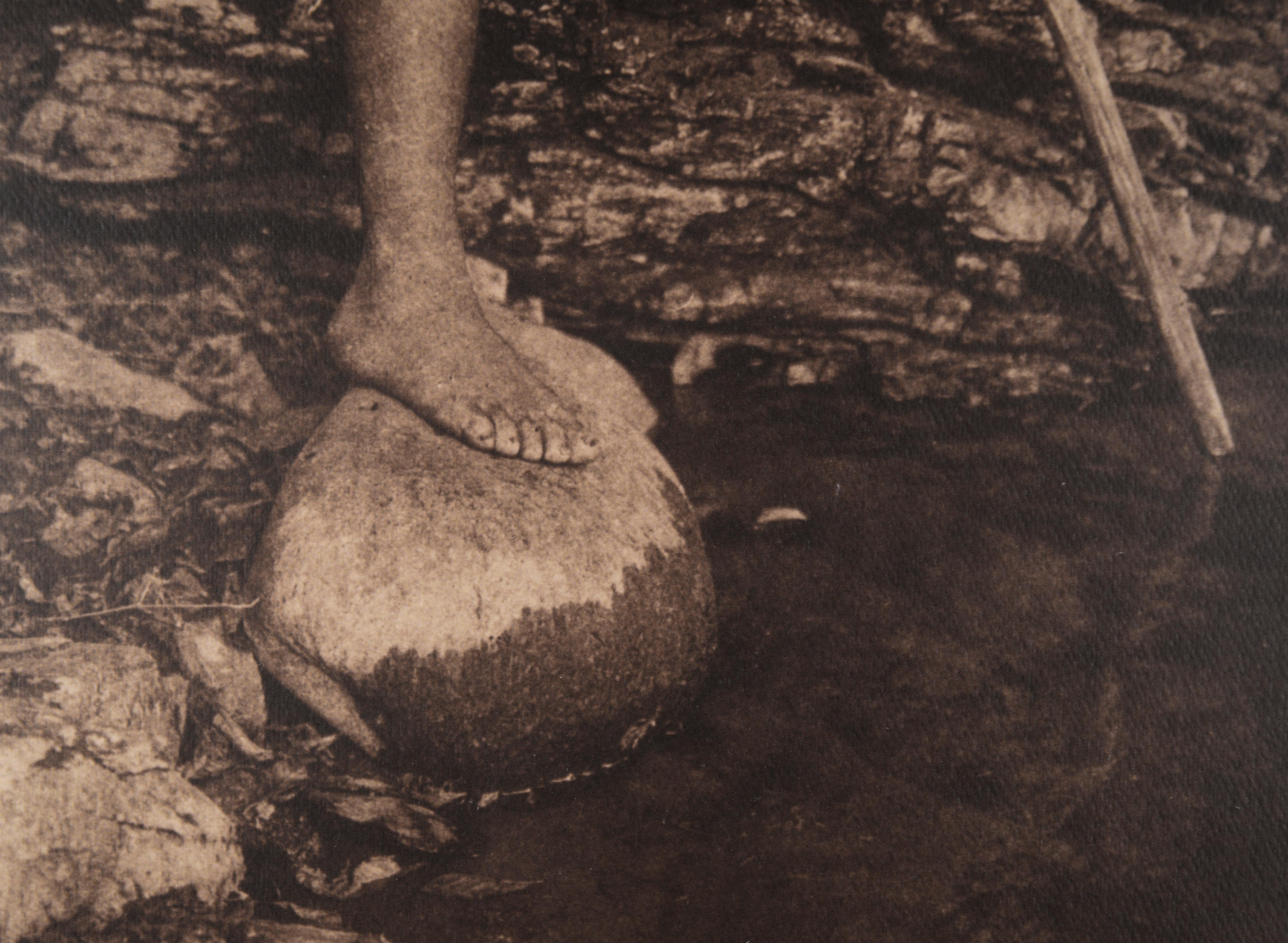 Silver and sepia tone photographic print of an indigenous spearfisher by Edward Sheriff Curtis, image circa 1901 (American, 1868-1952), as a 1974 copy of (and printed from negatives derived from) the original Edward Curtis copper gravure plate, by