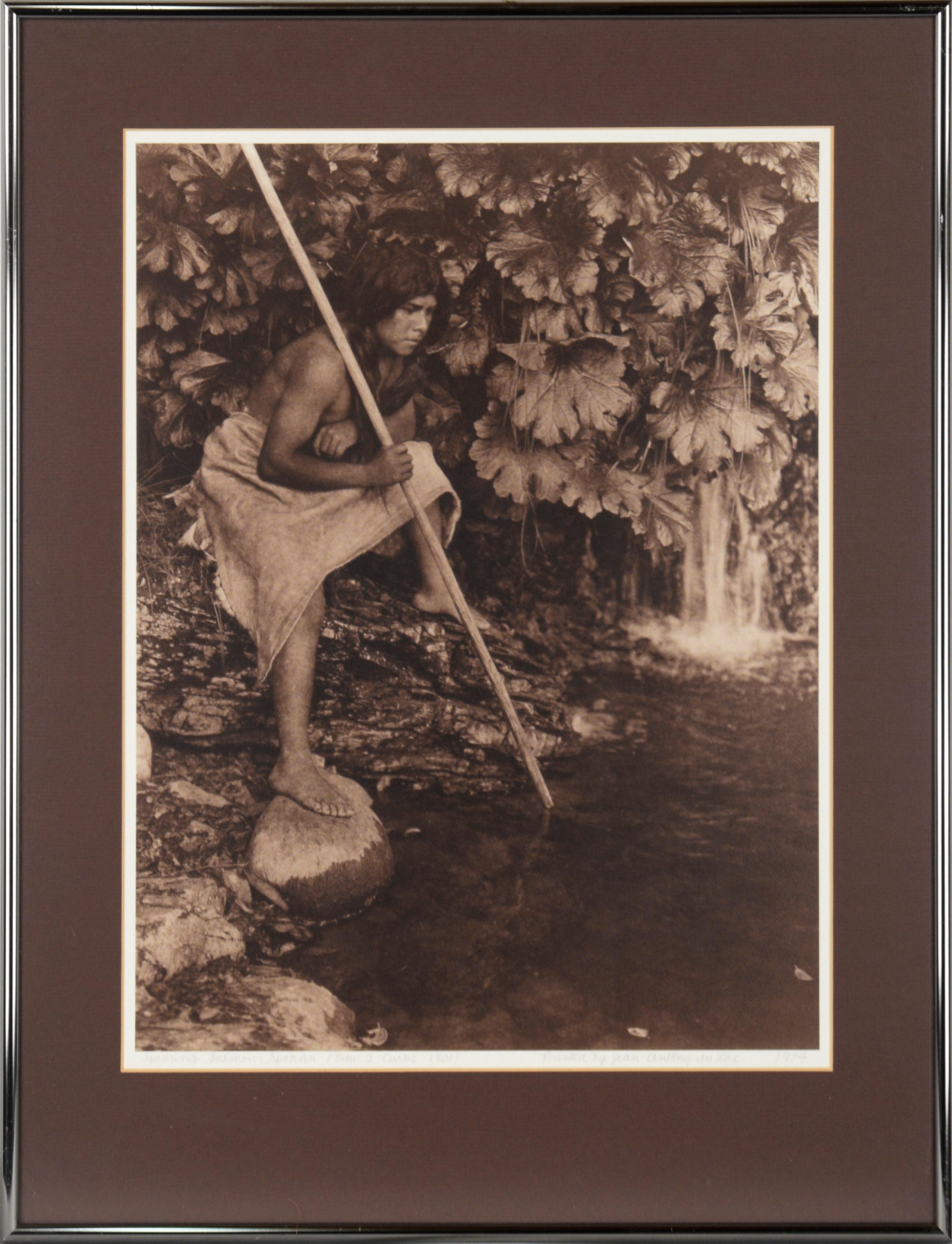 Edward Sheriff Curtis Landscape Photograph - "Spearing Salmon: Spokan", Sepia Photograph of Indigenous Spearfishing 