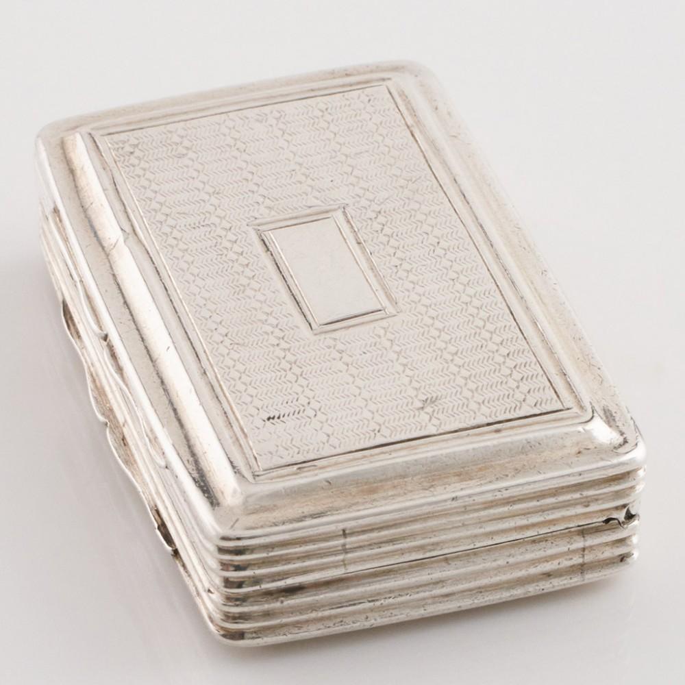 Heading : Edward Smith Sterling Silver Vinaigrette
Date : Hallmarked in Birmingham 1831 For Edward Smith
Period : William IV
Origin : Birmingham England
Decoration : Reeded decoration on the flanks. Vacant cartouche on machine engraved cover. Parcel