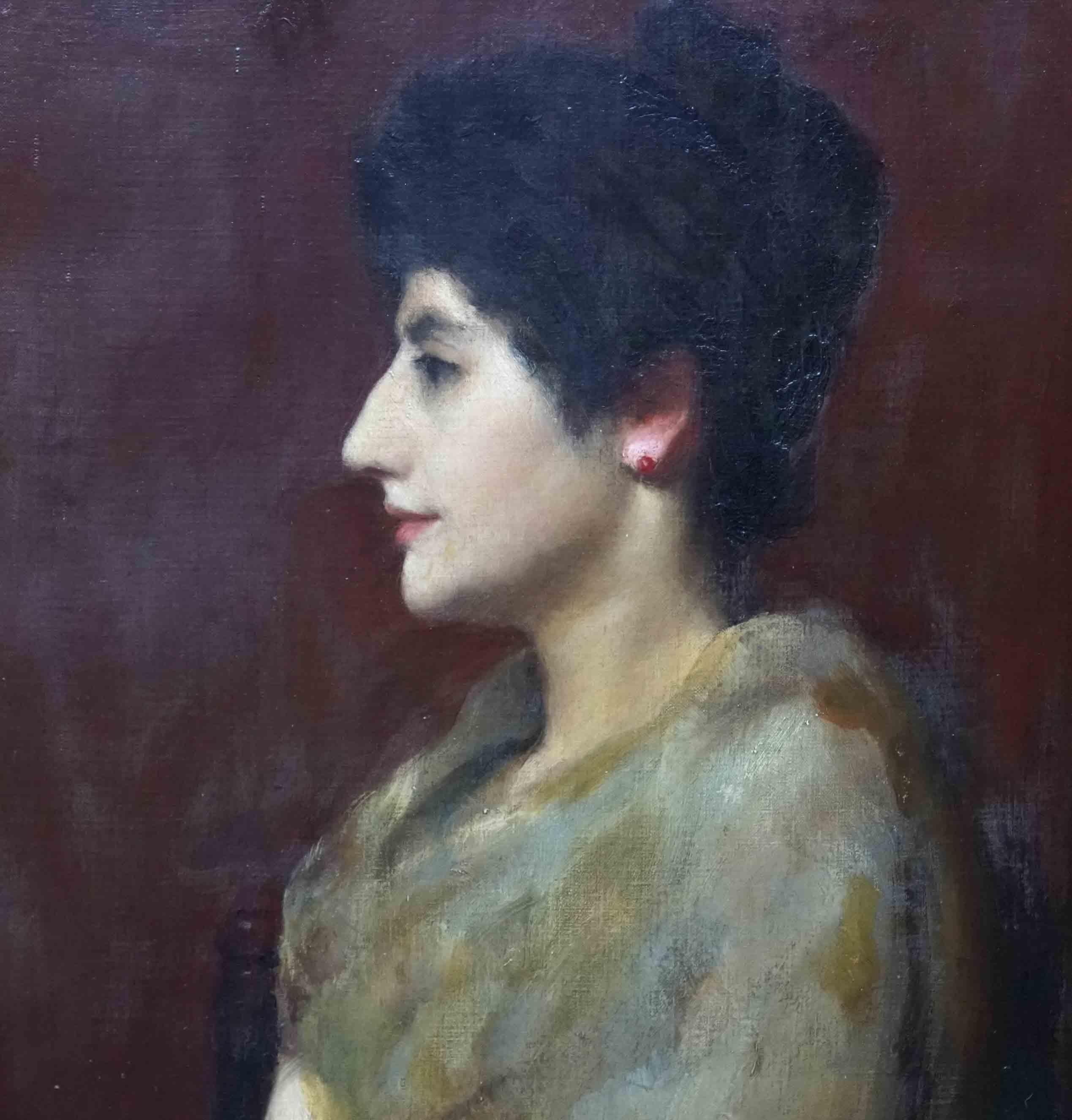 This lovely British Victorian portrait oil painting is by British portrait artist Edward Spilsbury Swinson. It was painted in 1891 and is dated and signed lower right. It is a half length profile portrait of a dark haired woman in a gold/brown dress