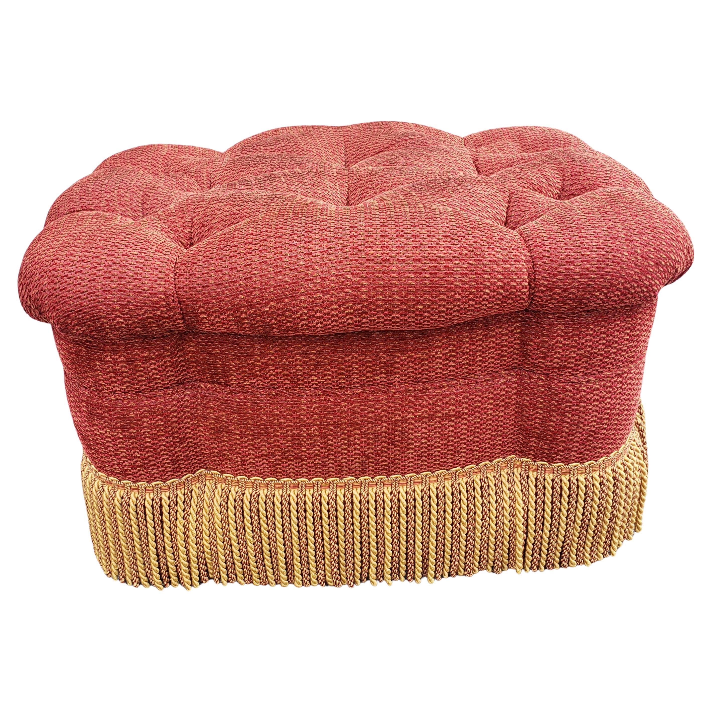 A Custom Made Rolling Upholstered and Tufted Ottoman with Fringes by Edward Springs.
Measures 29