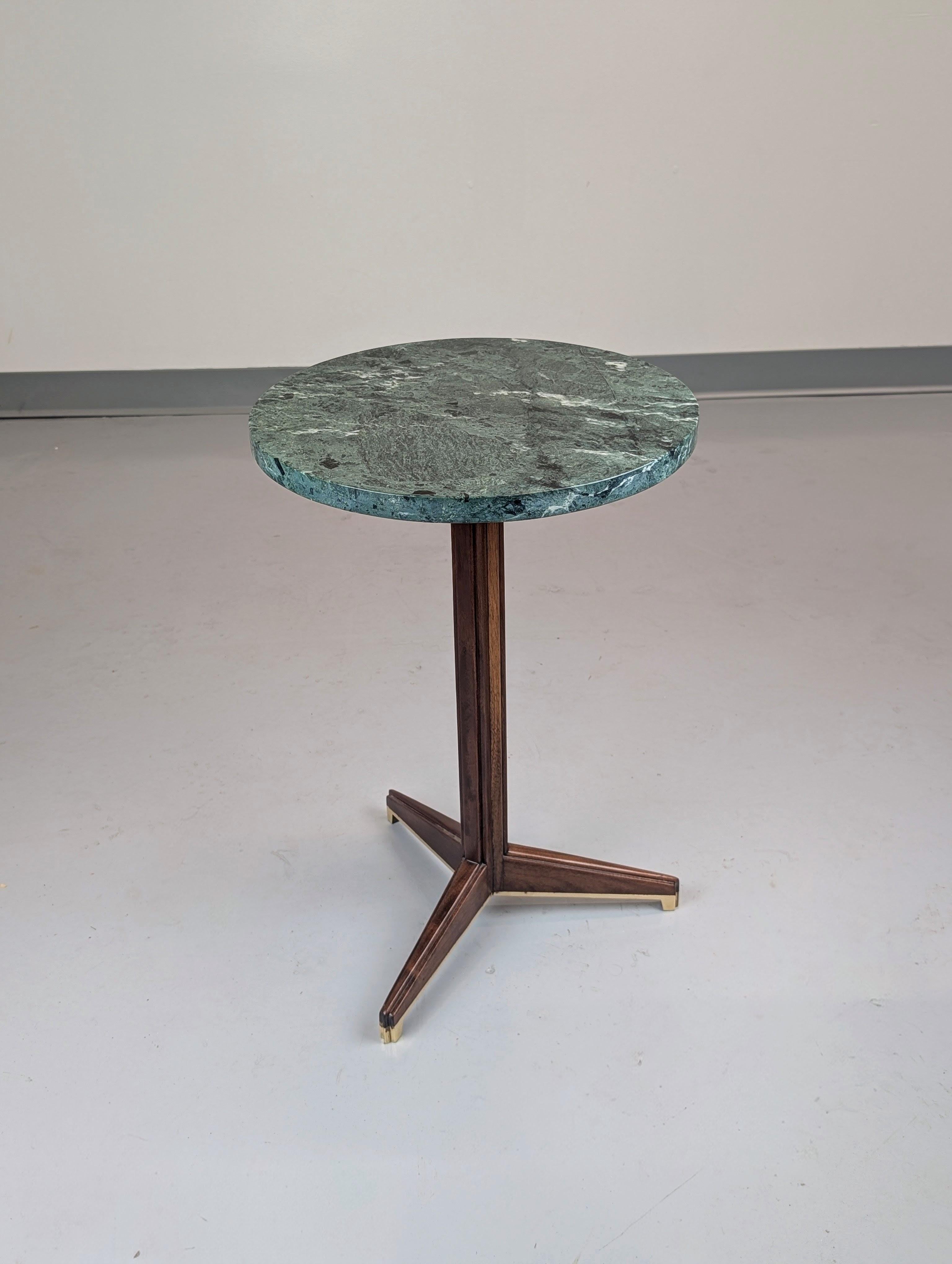Rare occasional table model #5928  A Table with its luxurious original verde antico marble top designed by Edward Wormley for Dunbar. Walnut base with brass boots. Excellent design. 