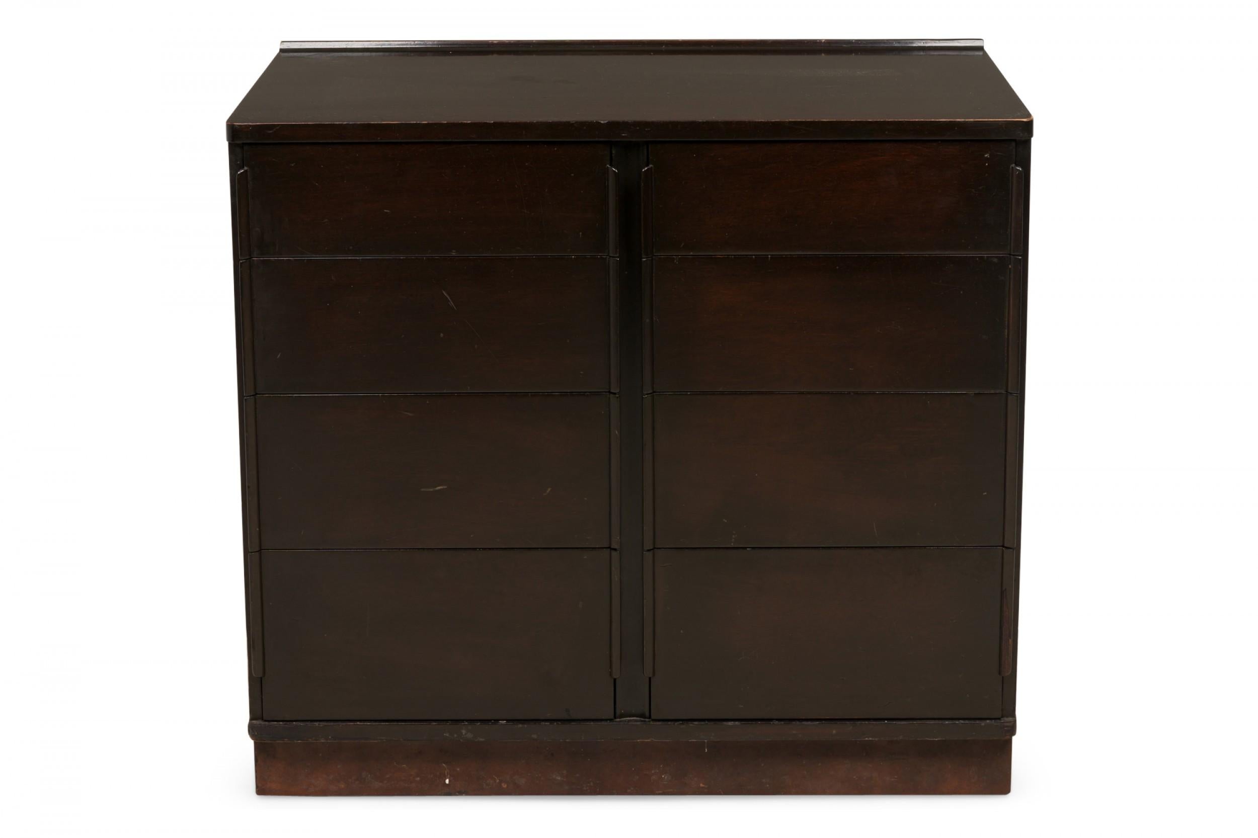 American mid-century eight-drawer chest with a dark stained wooden case. (EDWARD WORMLEY)