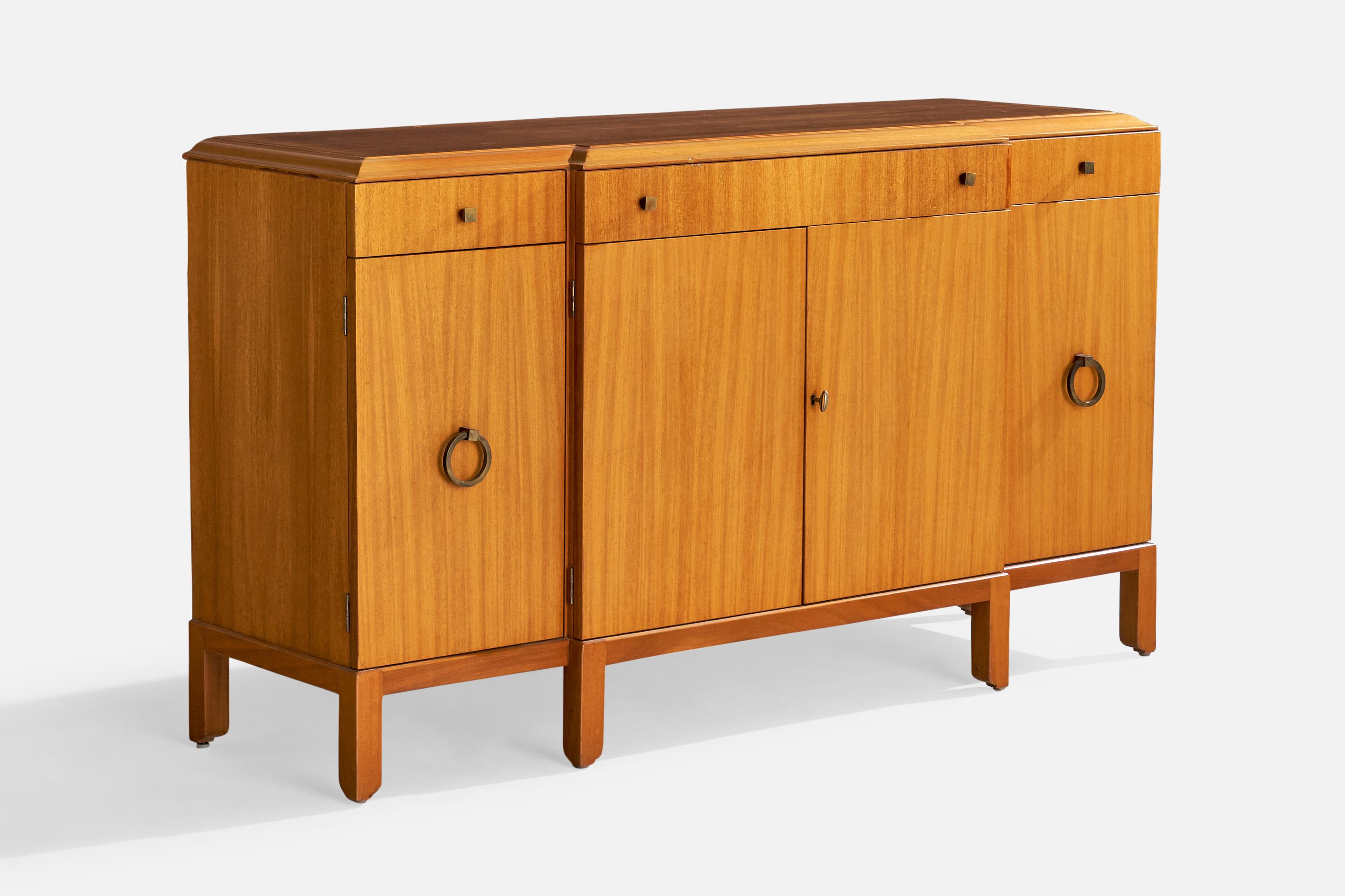 A mahogany and brass cabinet designed by Edward Wormley and produced by Dunbar, Berne, Indiana, USA, c. 1950s.