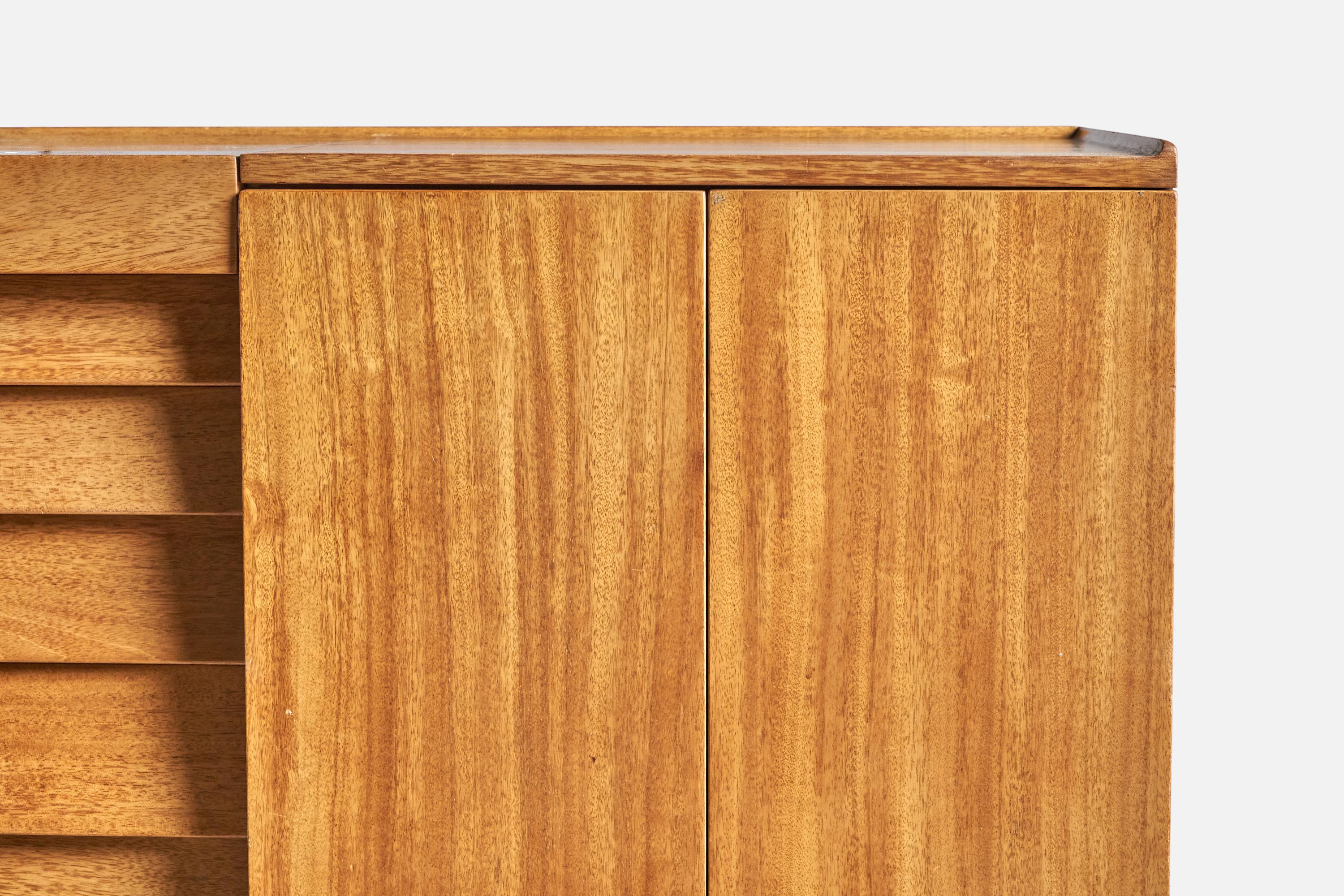 A sizeable walnut wardrobe or cabinet designed by Edward Wormley and produced by Dunbar, Berne, Indiana, USA, c. 1950s.

Interior has glass shelving and backside has round air grids intended for shoe storage.