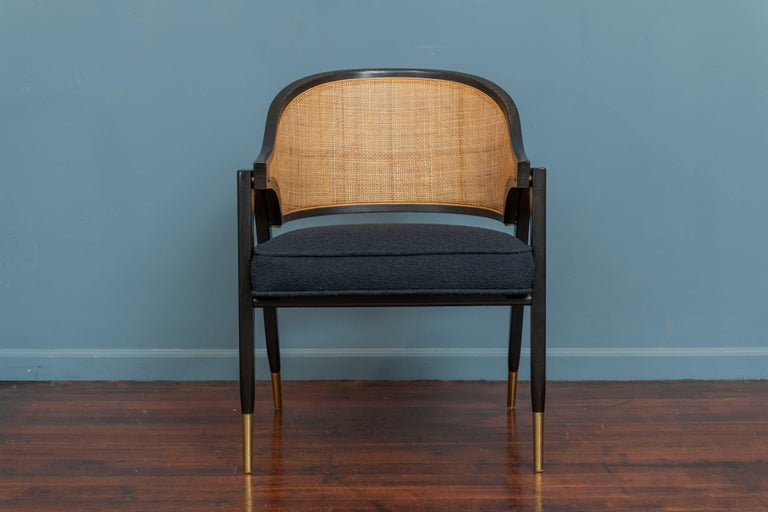 Edward Wormley design armchair or Captain's chair for Dunbar, Model 5480. Elegant and iconic design by Edward Wormley executed in lacquered ash molded plywood with original cane and finish with a newly upholstered seat.
 Very comfortable as a desk