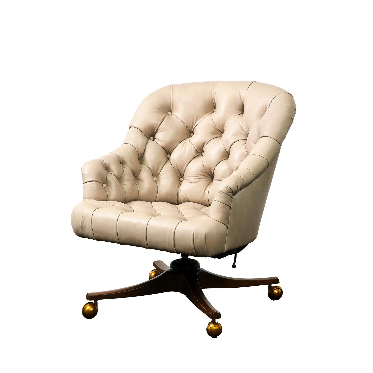Beautifully made “Barrel Tufted Desk Chair” model no 5400 in newly reupholstered calf skin leather with mahogany base with brass castors by Edward Wormley for Dunbar, American, 1954. This iconic desk chair is extremely comfortable and reclines. It’s