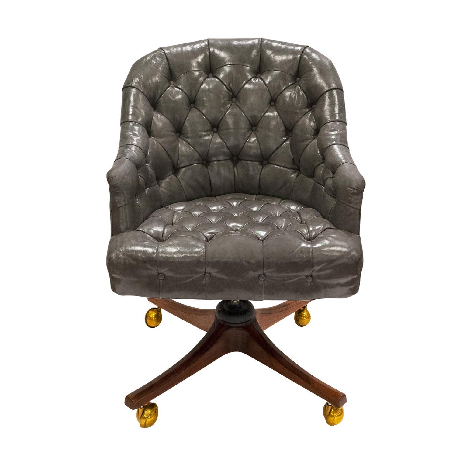 Beautifully made “Barrel Tufted Desk Chair”  model no 5400 with original gray leather on a mahogany base with brass castors by Edward Wormley for Dunbar, American, 1954 (signed “DUNBAR - Berne Indiana” on original metal label on bottom of chair). 