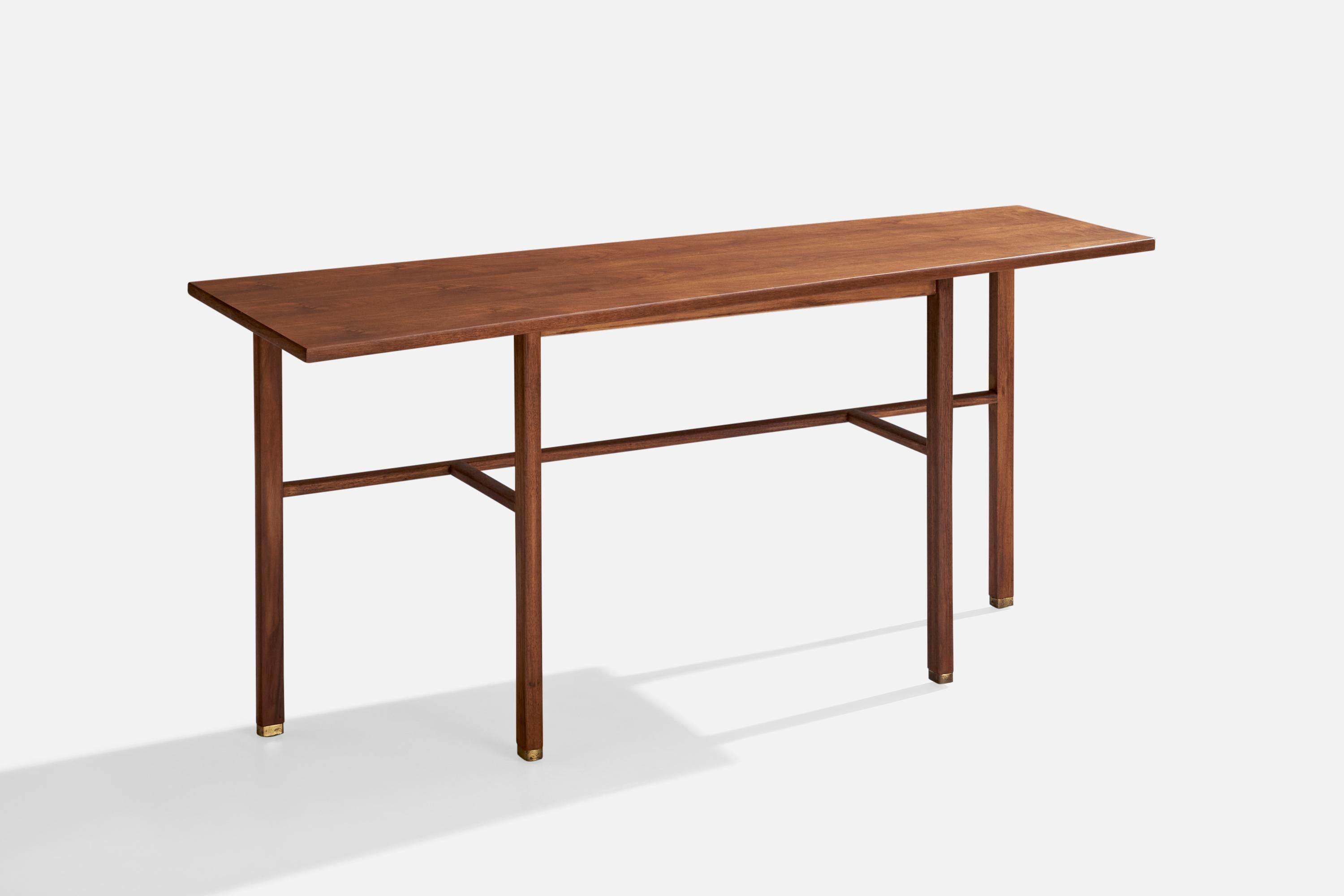 A walnut and brass console table designed by Edward Wormley and produced by Dunbar, Berne, Indiana, USA, 1950s.

Dimensions: 27.375” H x 59.875” W x 21.875” D