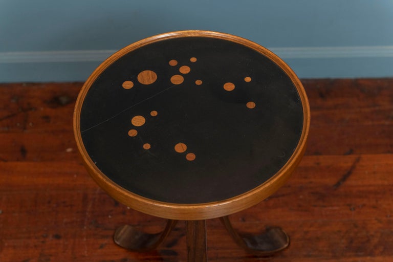 Edward Wormley design constellation side table for Dunbar Furniture, USA. Elegant little table perfect for drinks with a laminate top inlaid with wood circles to immitate stars. Splayed mahogany plywood legs give the table a fanciful attractive