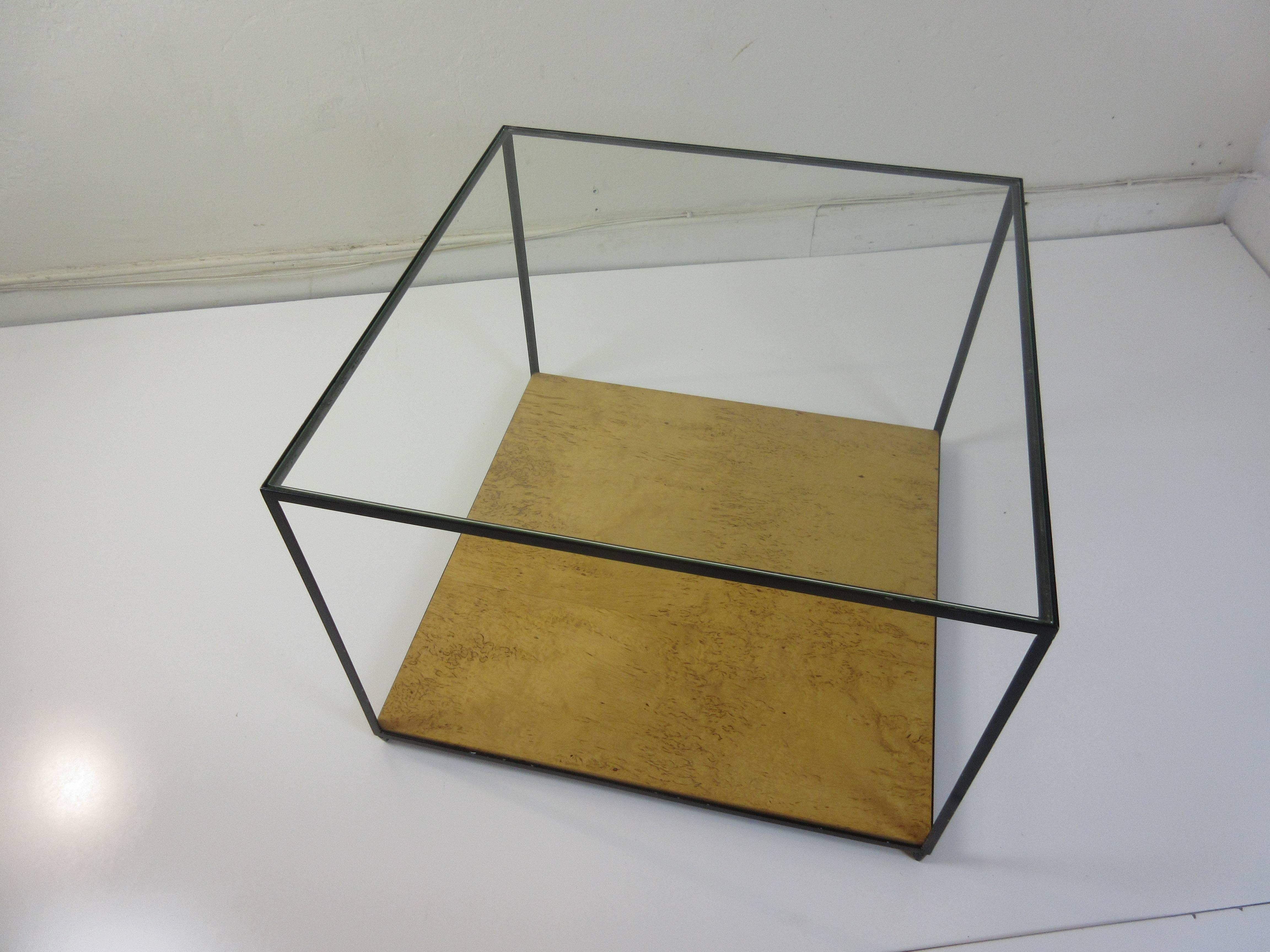 Edward Wormely glass cube coffee table from 1946 with burned in factory mark. Wood bottom shelf is burled birch with black steel frame and glass top.