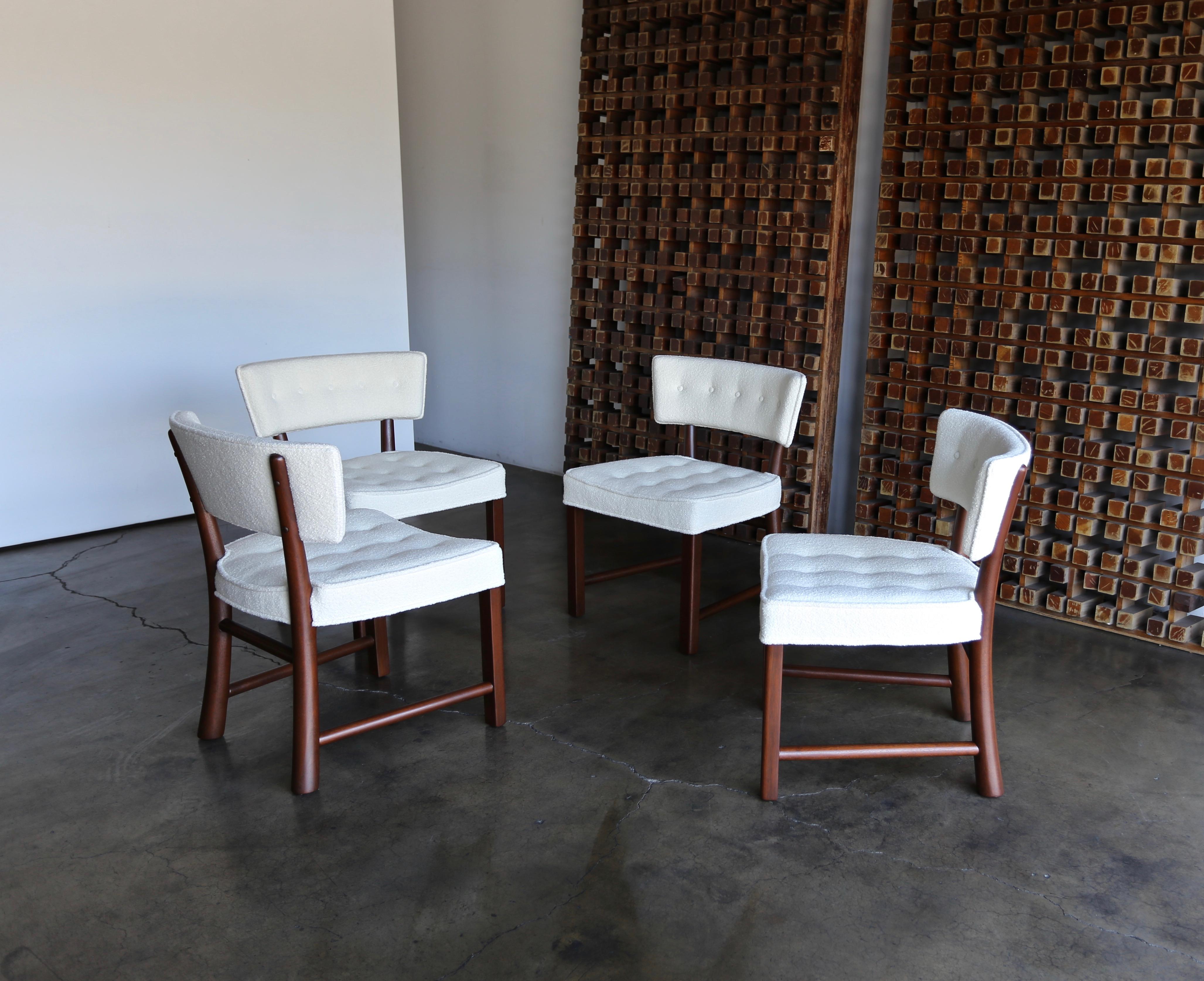 Edward Wormley dining chairs for Dunbar, circa 1957. This set has been professionally restored. Upholstered in holly hunt boucle. The listed price is for the set.