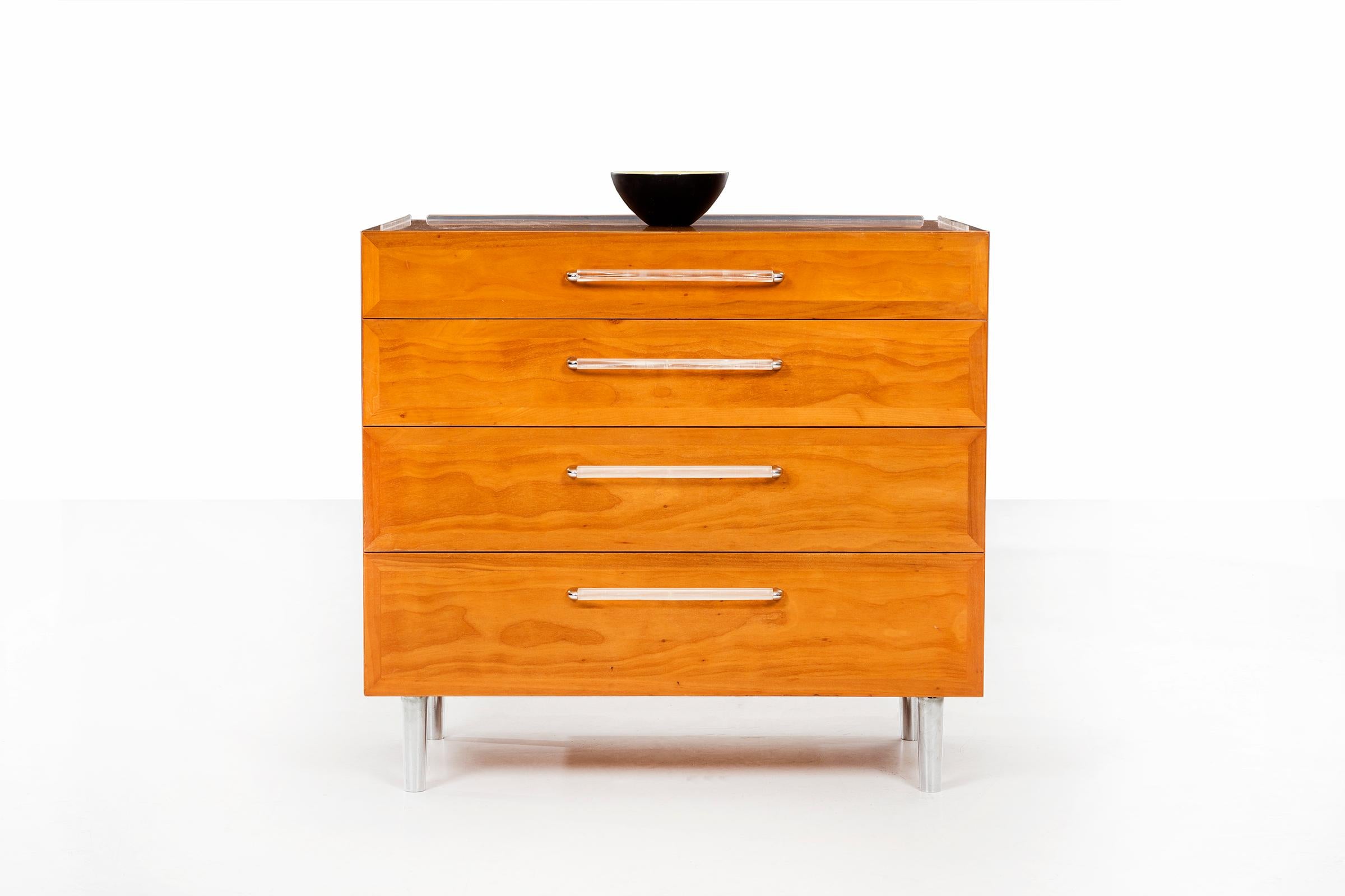 Wormley for Dunbar; Rare 4 drawer dresser, model 5530. Flush paneled drawer fronts in bleached cherry over solid mahogany wood on chrome-plated tapered legs, Lucite pulls. finished on backside.