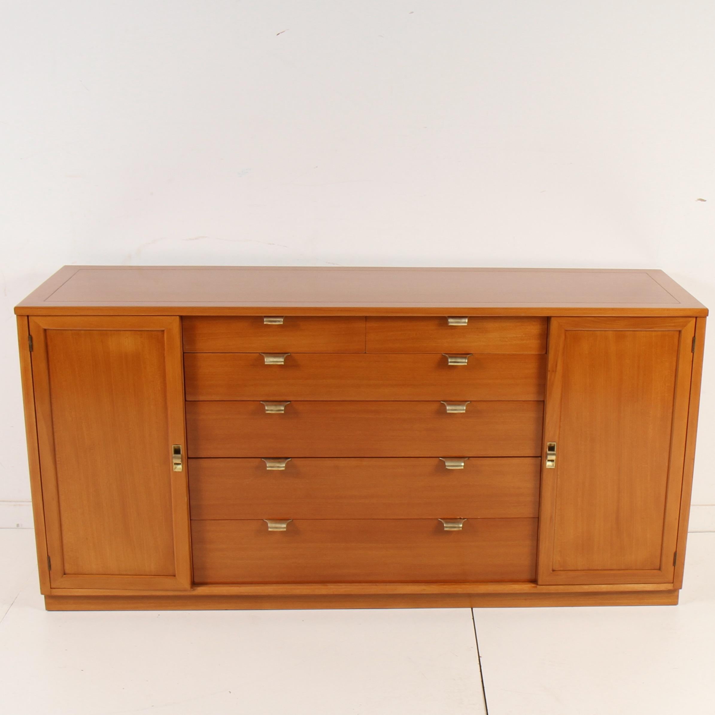 Late 40s era elm sideboard by Edward Wormley for Drexel. Newly refinished, this piece features six shelves for plates and six drawers for silverware and various other items. Could also be used as a dresser.

Edward Wormley (1907-1995) created many