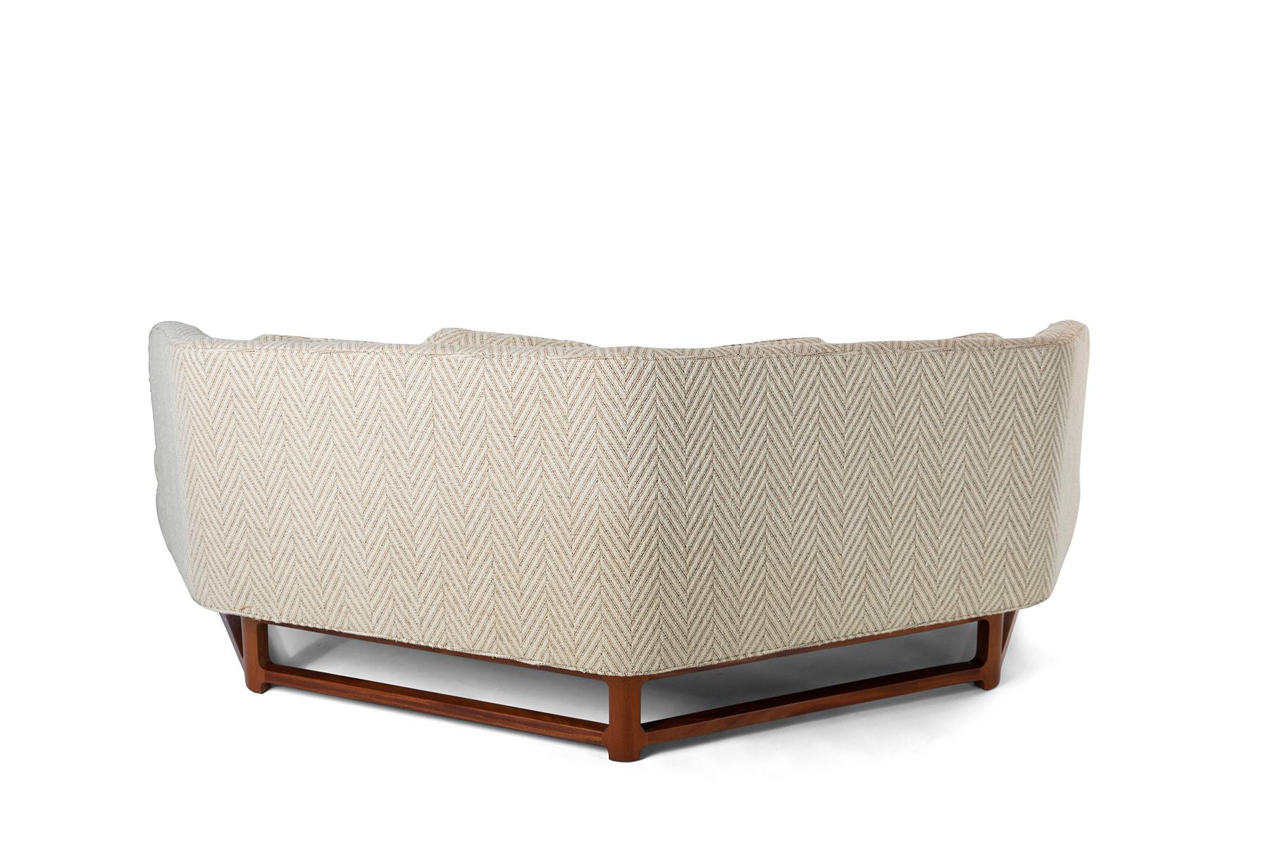 Janus sofa designed by Edward Wormley for Dunbar circa early 1950's. The light cream colored herringbone upholstery is original and in incredible condition. The solid mahogany base has been refinished.