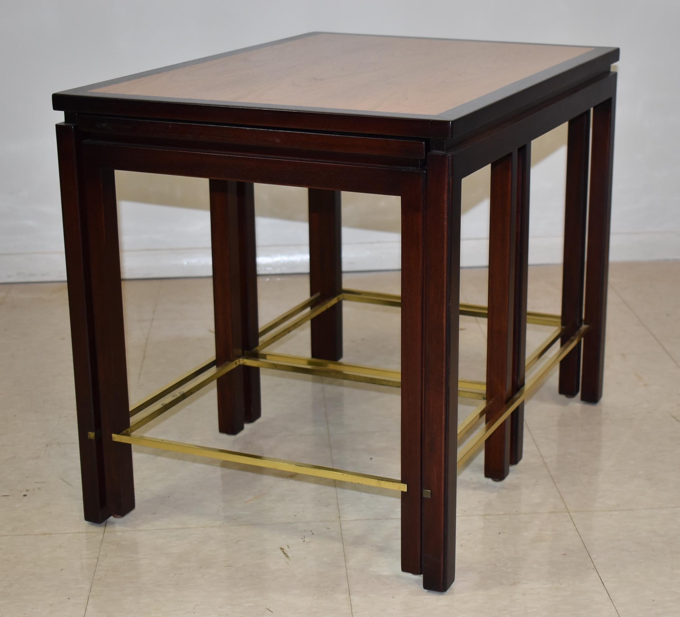 Mahogany and walnut nesting tables by Edward Wormley for Dunbar. Square brass supports. Very nice condition with light oxidation on brass. Main table measures 20