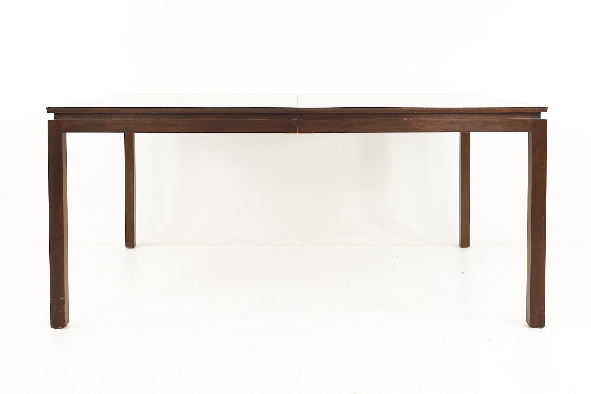 Edward Wormley For Dunbar Mid Century Mahogany and Walnut Two Tone Expanding Dining Table With 3 leaves

The table measures: 66.25 wide x 44.25 deep x 29.5 high, with a chair clearance of 26.25 inches; each leaf is 24 inches wide, making a maximum