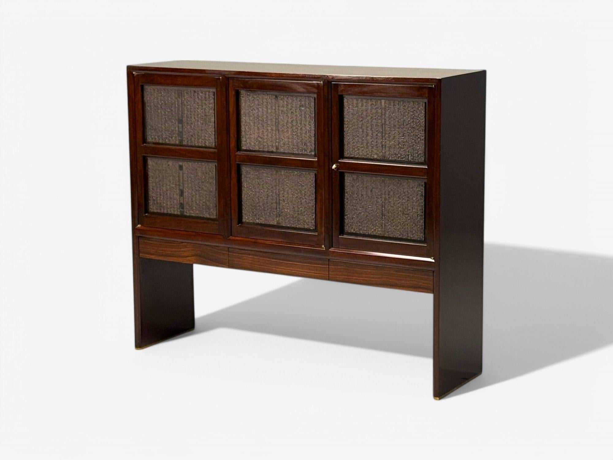 Edward Wormley, Dunbar, Mid-Century Modern, Rosewood, Chinese Cabinet, 1960s

A tall cabinet designed by Edward Wormley (American, 1907-1995) for Dunbar showcasing antique Chinese printing blocks. This example features three drawers and three doors