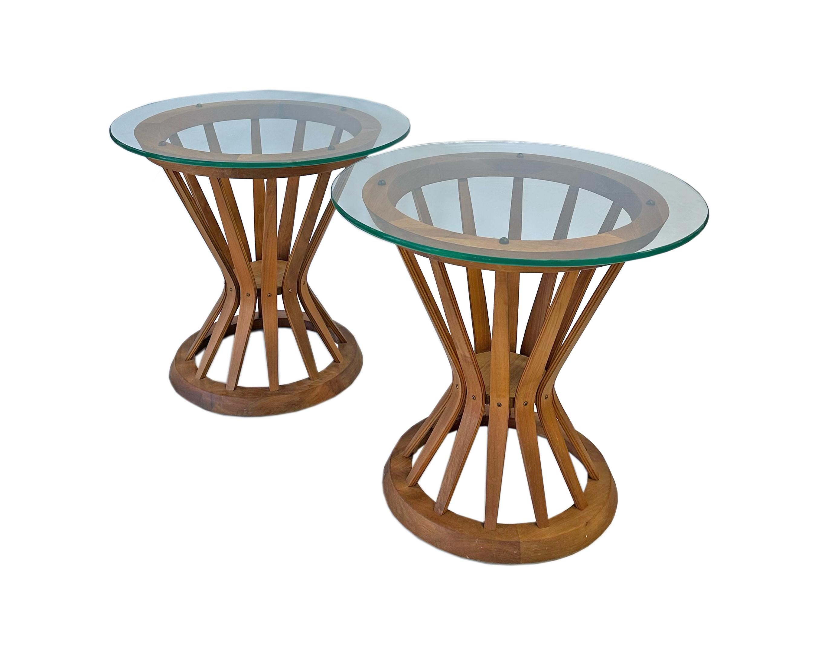 A pair of Sheaf of Wheat side tables designed by the American designer Edward Wormley (1907-1995) for Dunbar. These tables have an abstracted hourglass-shaped wooden base reminiscent of a sheaf of wheat. Unmarked, the top of each table is a resting