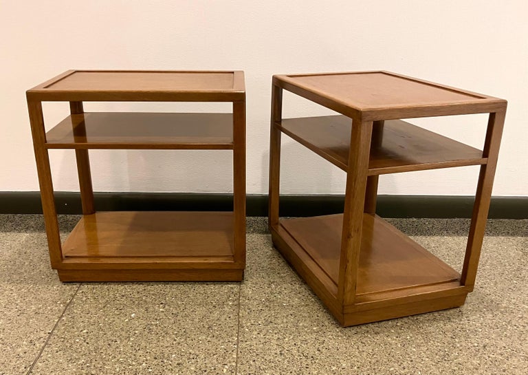 Perfect, architectural 3-tier mahogany side tables by Edward Wormley.  This simple, streamlined design typifies Wormley’s restrained modern style of the 1940s.  The pair retains their original amber finish, which has acquired a handsome, authentic