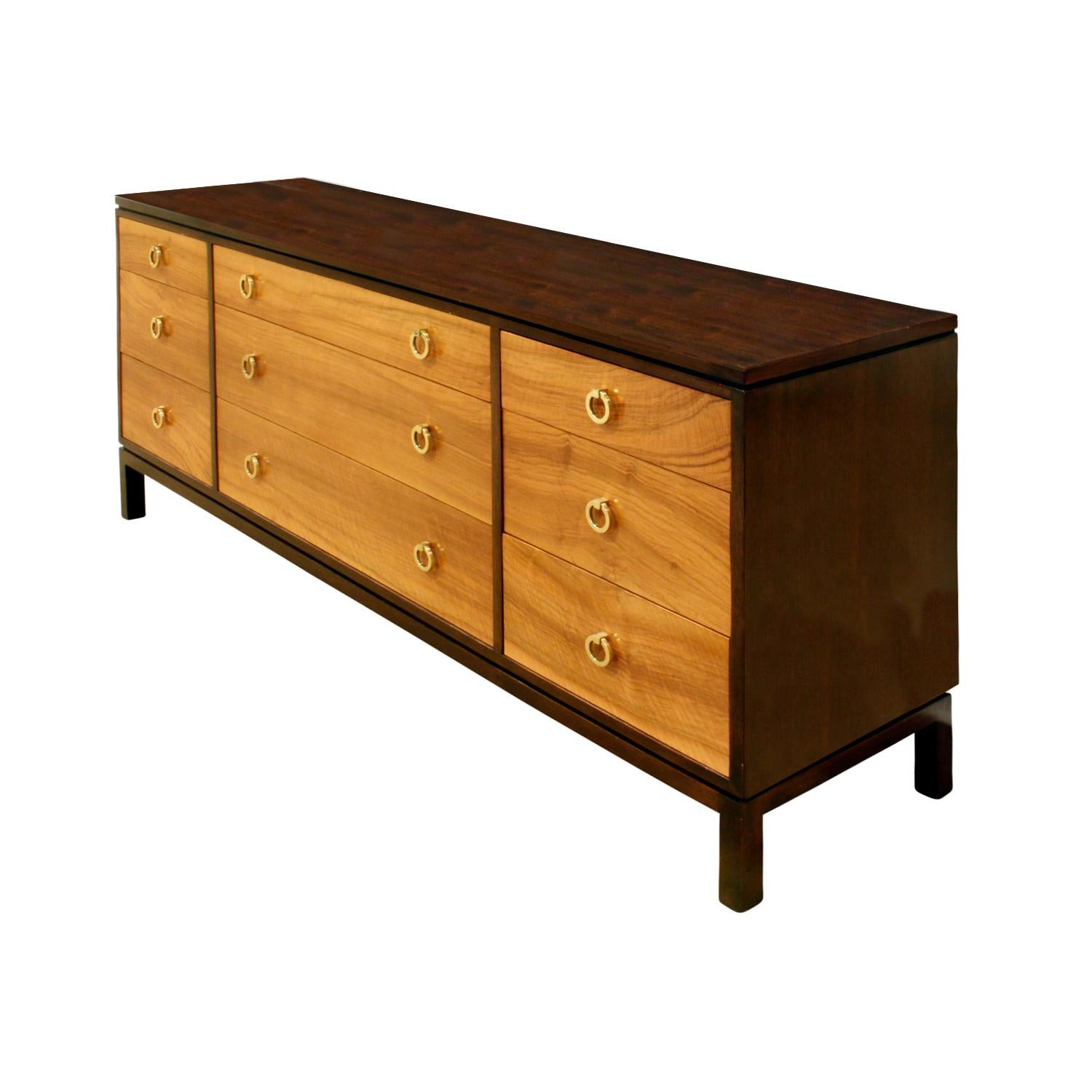 Long chest model No. 6423 in mahogany with drawer fronts in French walnut with brass ring pulls by Edward Wormley for Dunbar, American 1964 (Brass label in left interior drawer reads “Dunbar, Berne, Indiana” and paper label on the back reads “Dunbar