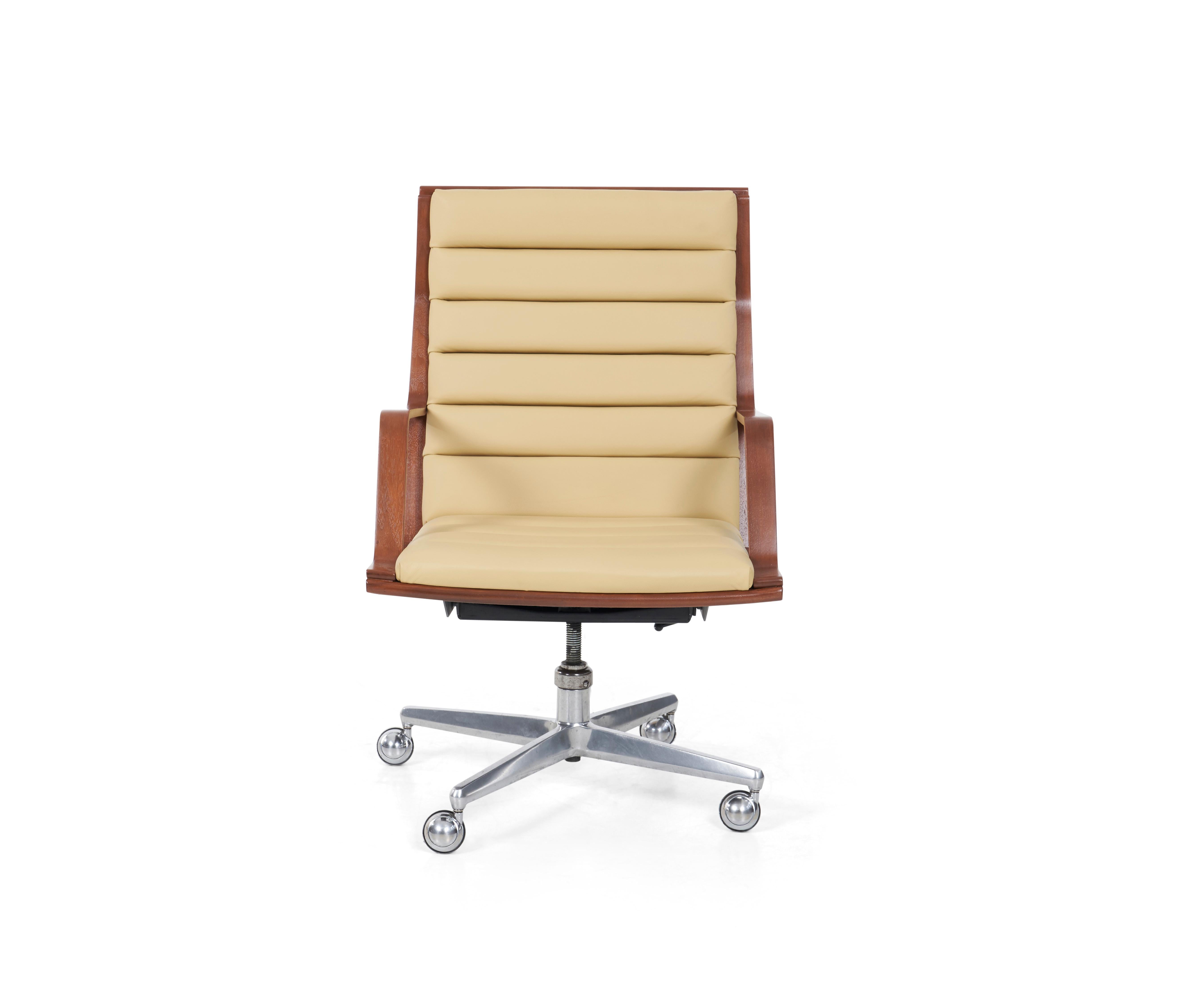 Wormley for Dunbar Desk chair, Channel seat and back Spinneybeck leather with mahogany woof frame, cast aluminum swivel base on 4 metal casters chairs.
