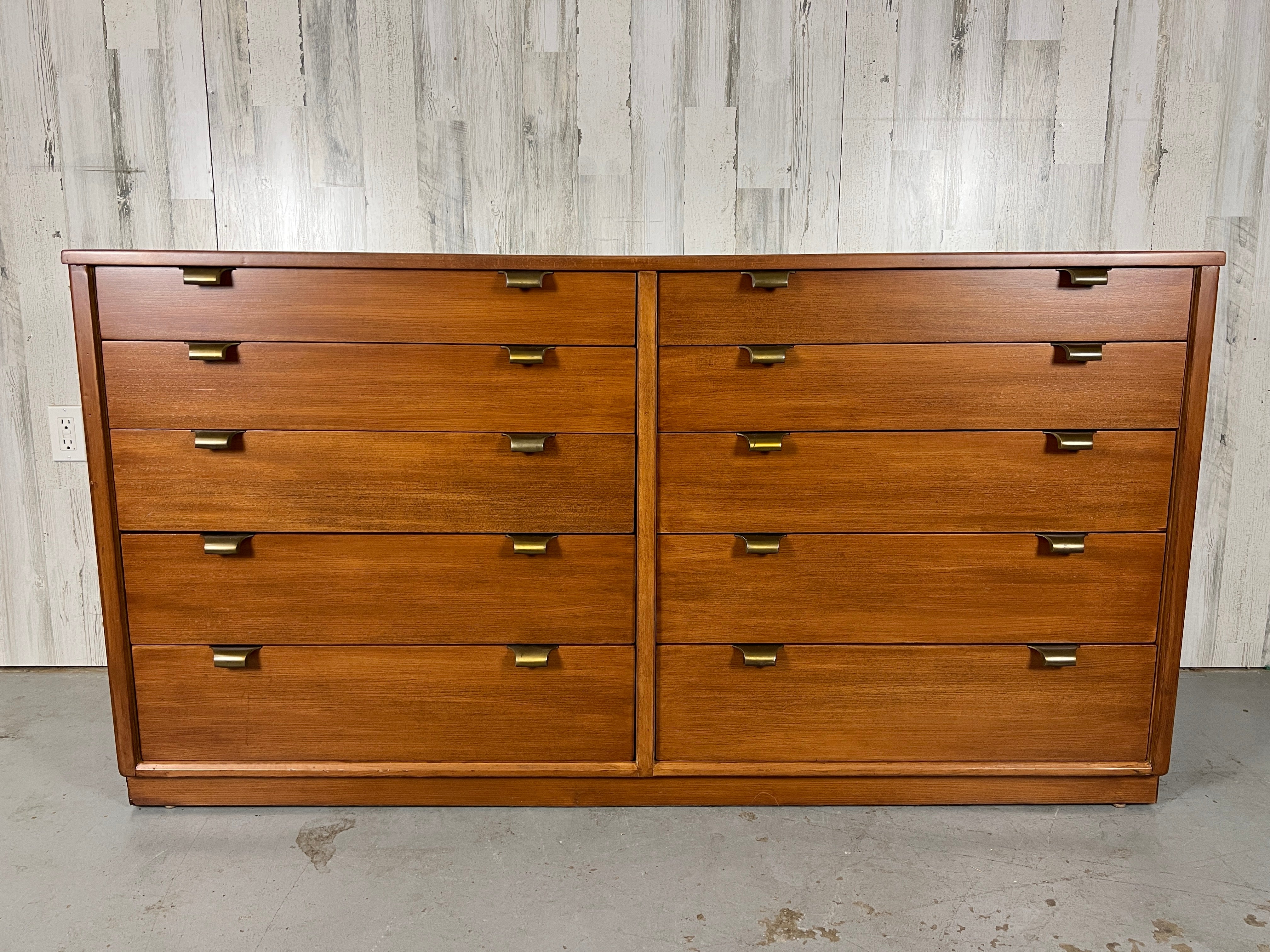 Edward Wormley for Drexel for their Precedent furniture line. The dresser is made of stained elm with original solid brass hardware.