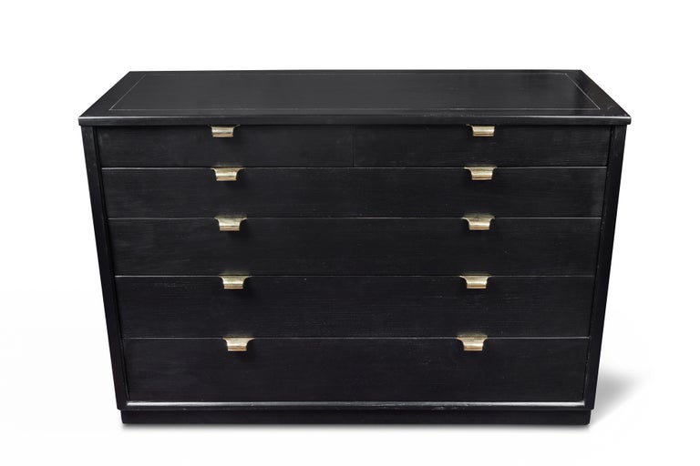 Beautiful classic, mid-century dresser designed by Edward Wormley for Drexel for their Precedent furniture line in the 1940's. The dresser is made of ebonized elm with original solid brass hardware which has been newly polished. There are four long