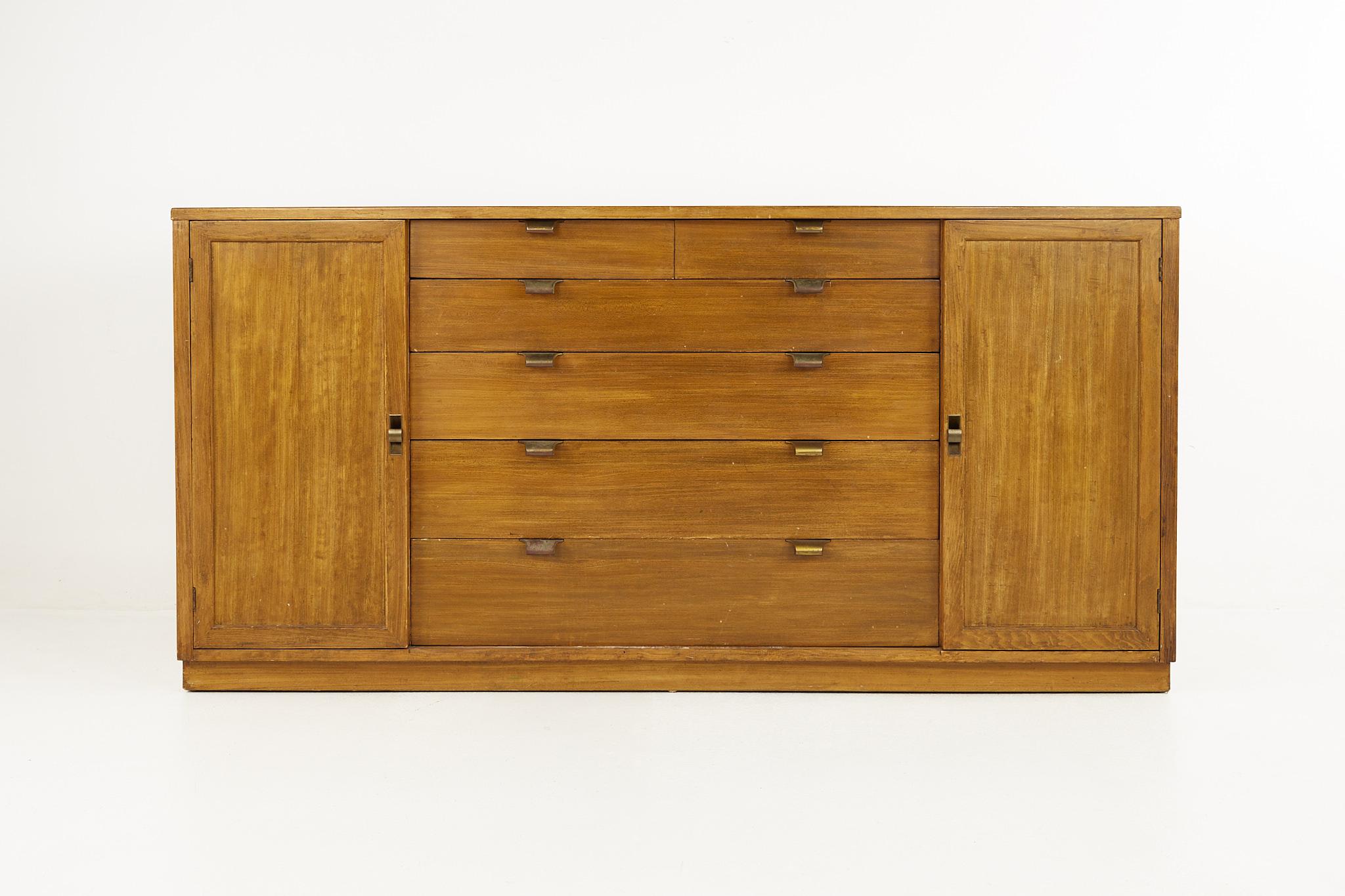 Edward Wormley for Drexel precedent mid century brass and elm credenza

Credenza measures: 66.75 wide x 20 deep x 32.75 inches high

All pieces of furniture can be had in what we call restored vintage condition. That means the piece is restored