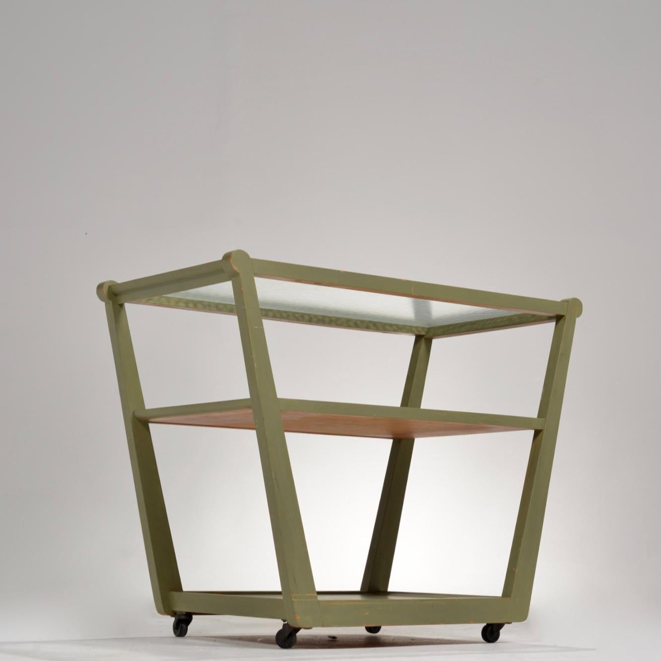 Pistachio green rolling bar cart from the Precedent series by Edward Wormley for Dunbar circa 1960. 
3 tiered rolling cart featuring a textured glass top and casters. 

Precedent by Drexel stenciled on the bottom.