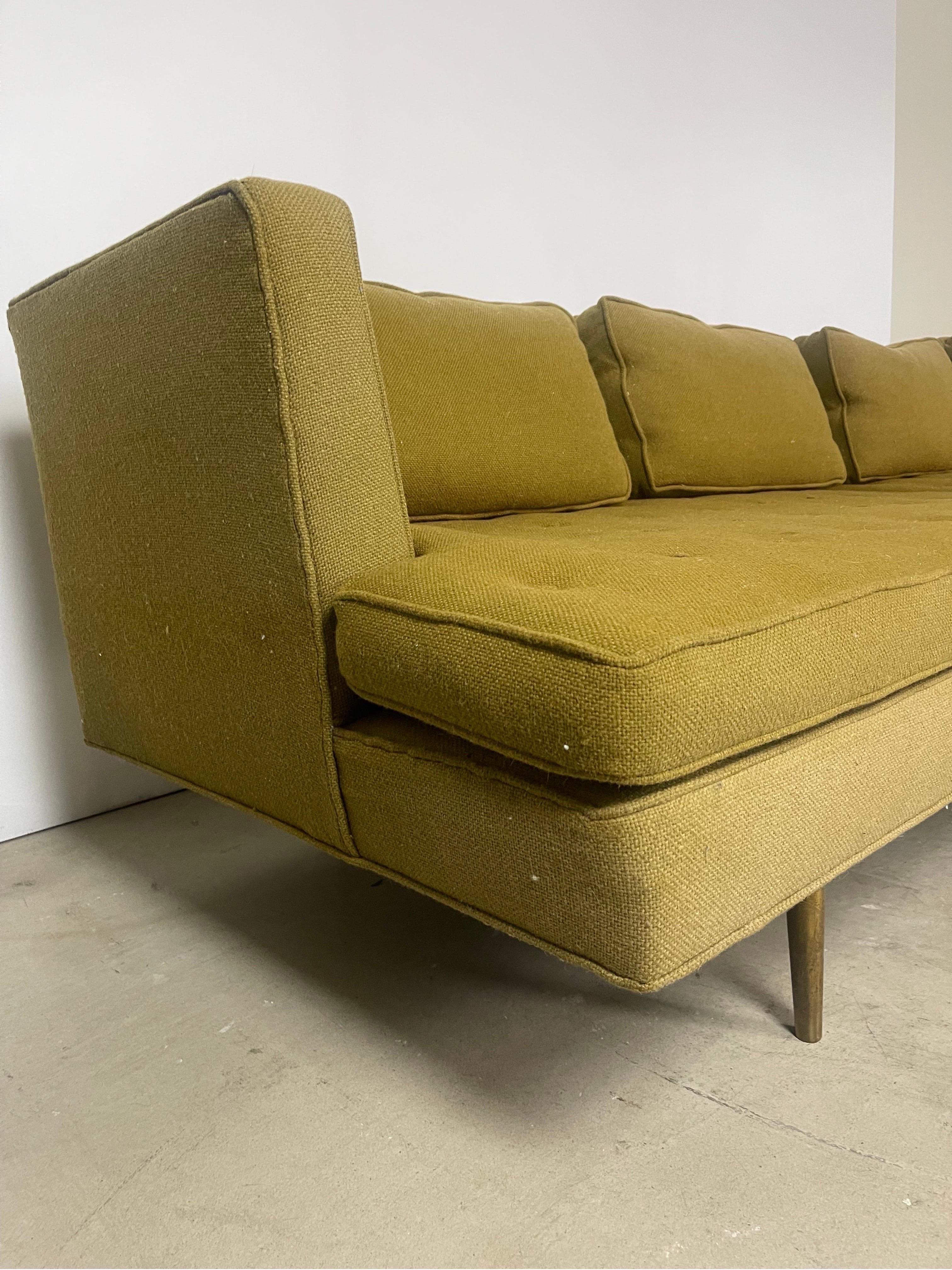 Description:
This is a classic Edward Wormley for Dunbar 4907 sofa with original upholstery and brass legs. This sofa showcases Wormley's signature design style, featuring a sleek silhouette with clean lines and a low profile. The original green