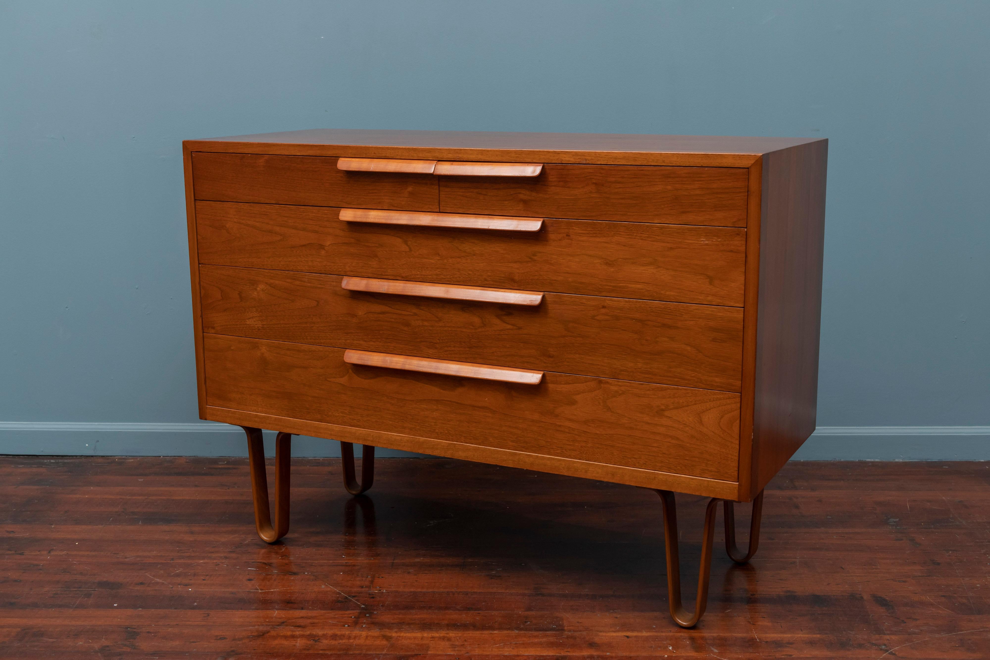 Edward Wormley design walnut chest of drawers for Dunbar Furniture Company, Berne Indiana. 
Rare form five drawer low chest on molded bentwood legs in very good original condition, tagged.