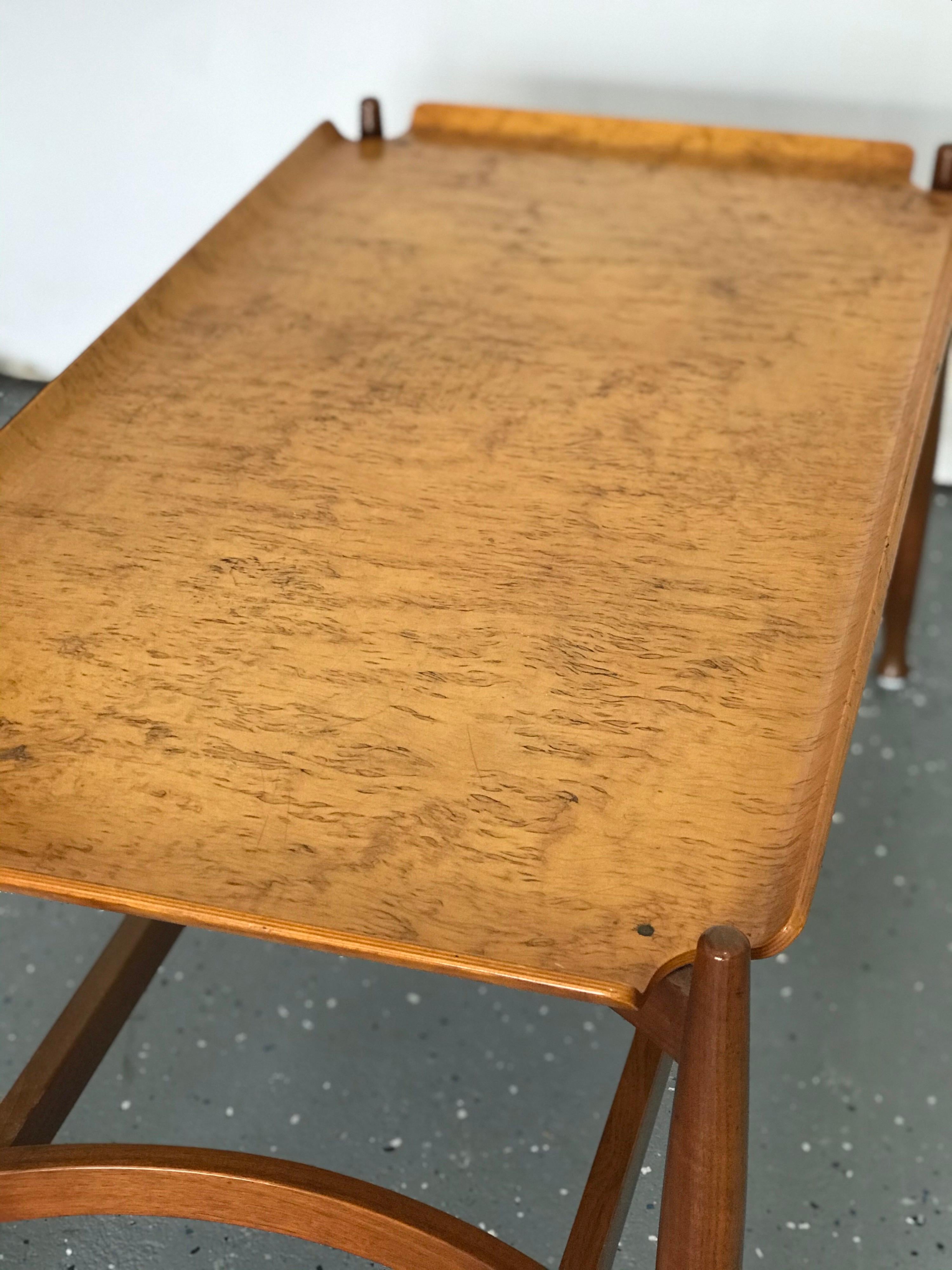 Rare and elegant table designed by Edward Wormley for Dunbar. Table consists of a walnut base with tapering legs which supports a bent burled birch tray-like top. Table is structurally sound, and in good condition. Some wear to the tabletop.