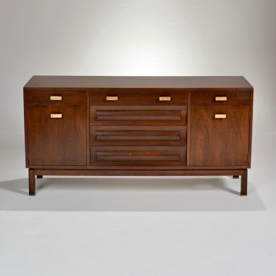 Unique credenza in walnut with Travertine drawer pulls designed by Edward Wormley for Dunbar.