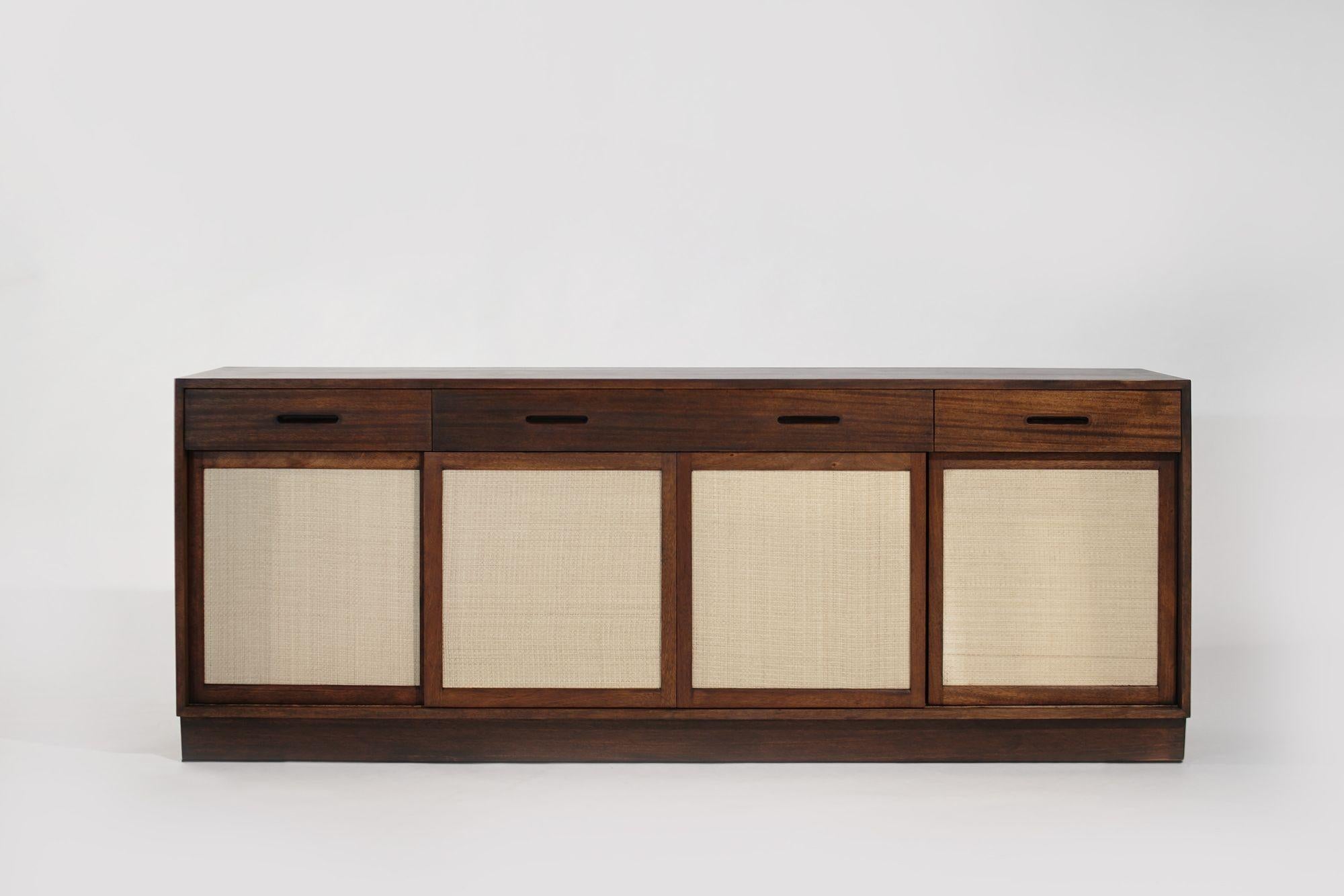 A mid-century modern gem, this mahogany credenza by Edward Wormley for Dunbar exudes timeless elegance. Meticulously restored, its sleek design and ample storage make it a versatile and stylish addition to any space. Add a touch of mid-century flair
