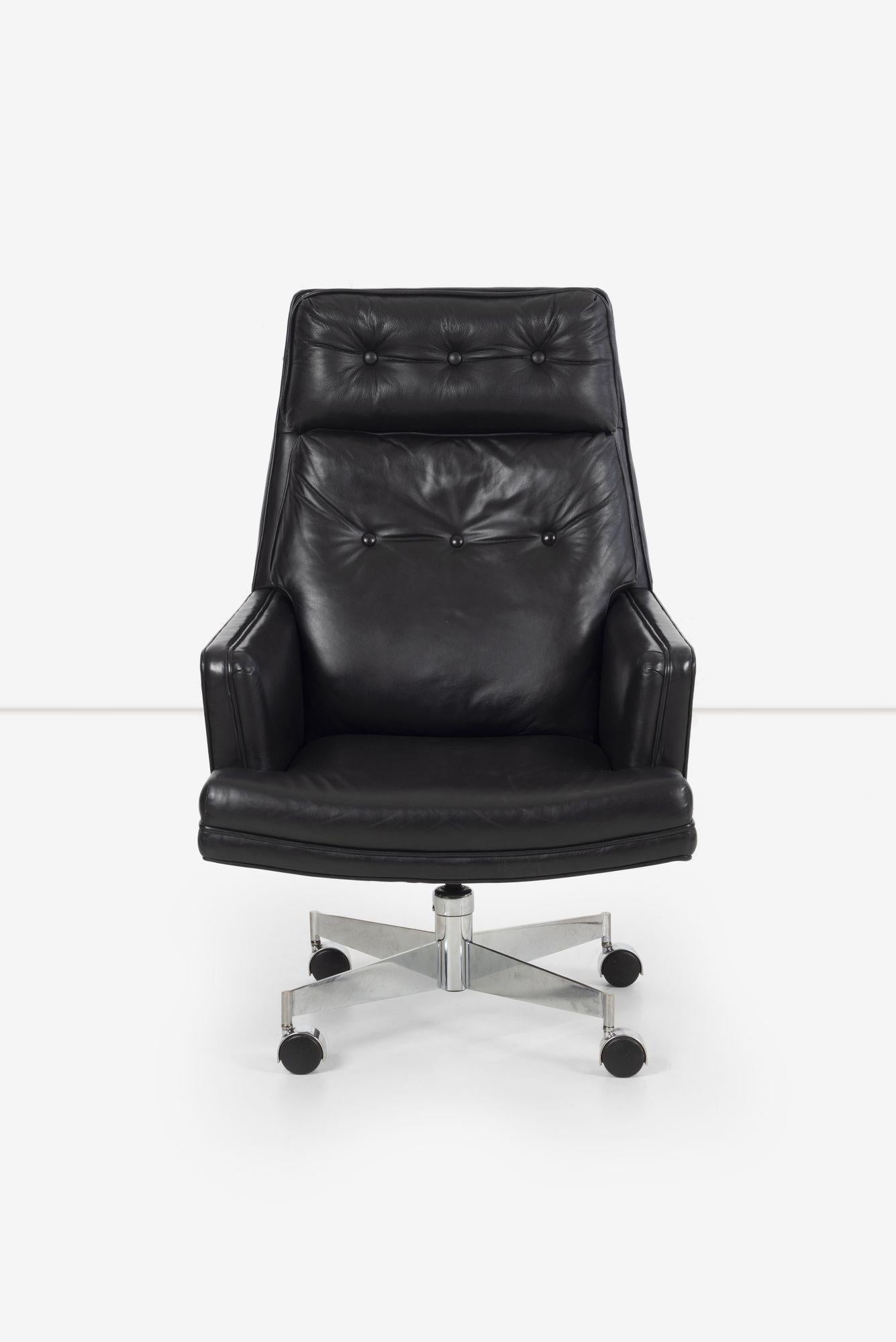 Edward Wormley for Dunbar Executive Chair with chrome plated steel base on castors, features button tufted back and headrest in original black leather, swivel functionality, and a tilt mechanism with a tension lever to secure the desired tilt