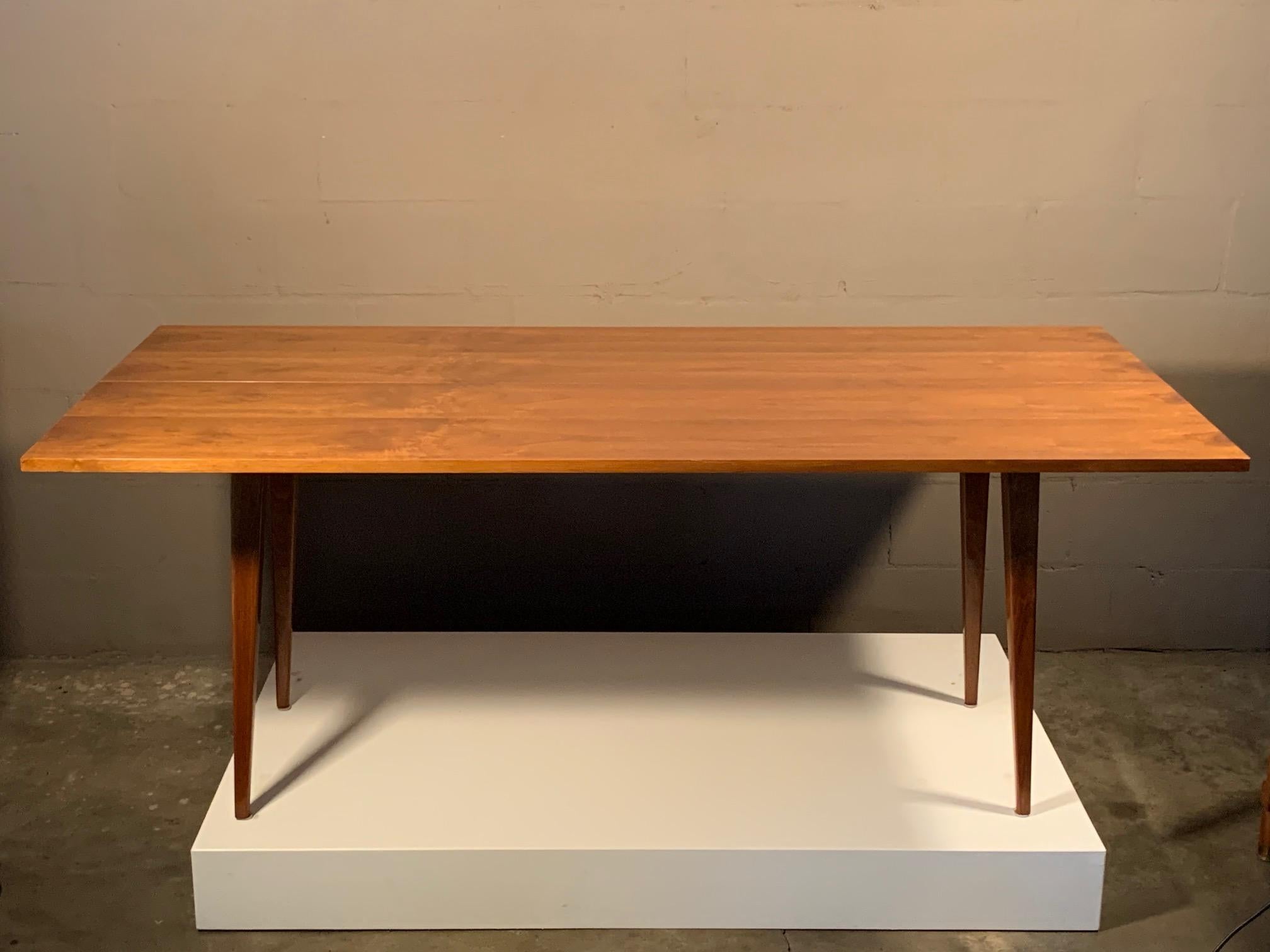 A Classic console table by Edward Wormley for Dunbar. Top extends from 17 to 34