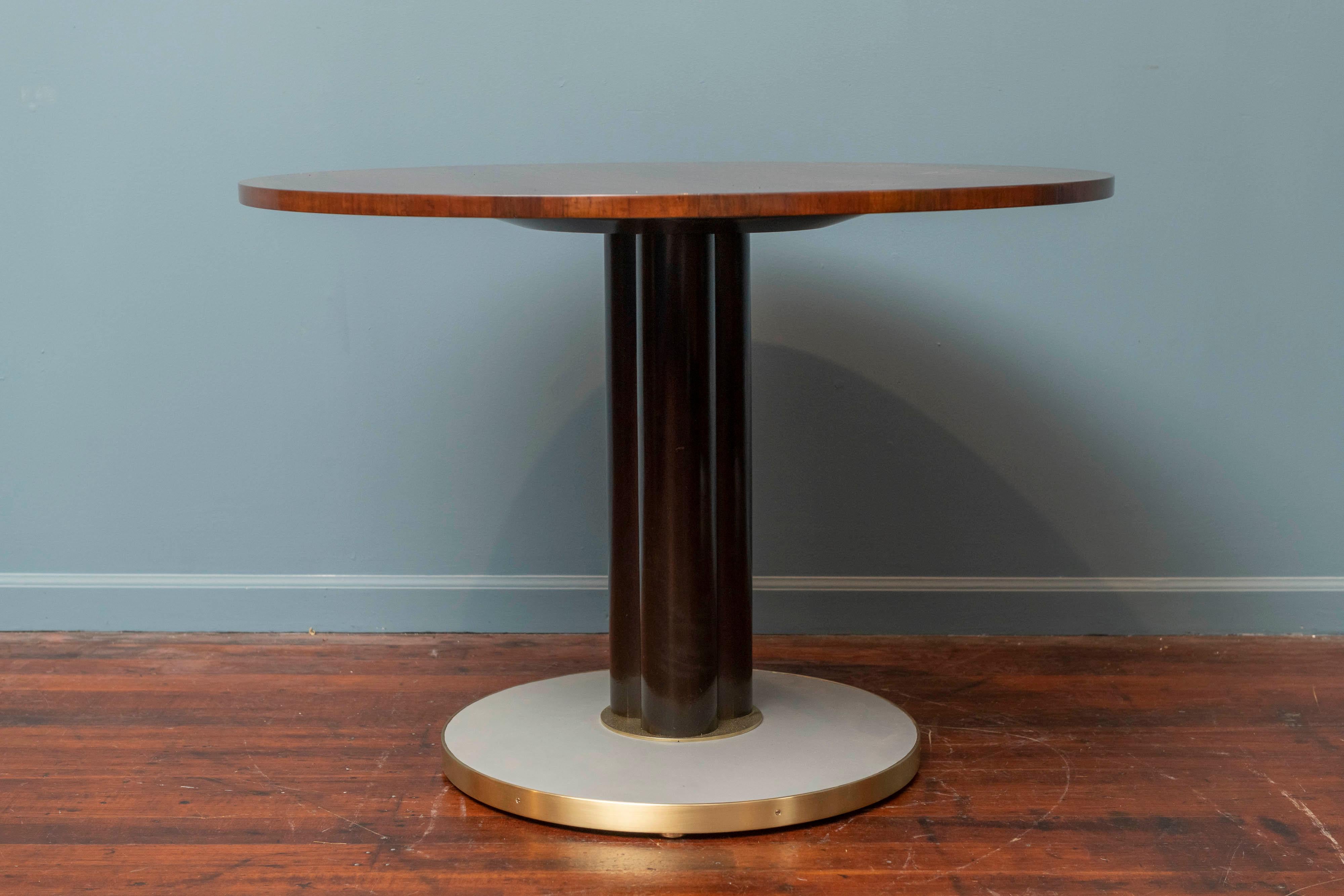 Edward Wormley design for Dunbar game or center table, a stunning rosewood top on an ebonized column-form pedestal supported by a weighted brass and light grey leather wrapped base.
Perfectly refinished, labeled Dunbar.